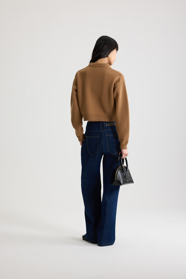 Patou - Wide waistband trousers in cotton denim - Rodeo Blue - Rodeo Blue cotton denim trousers. Mid to low waist. Straight leg. Belt loops. Fastens via a gold-tone Patou logo-engraved button and concealed zip at the front. Pockets at the sides. Pressed crease at the front.