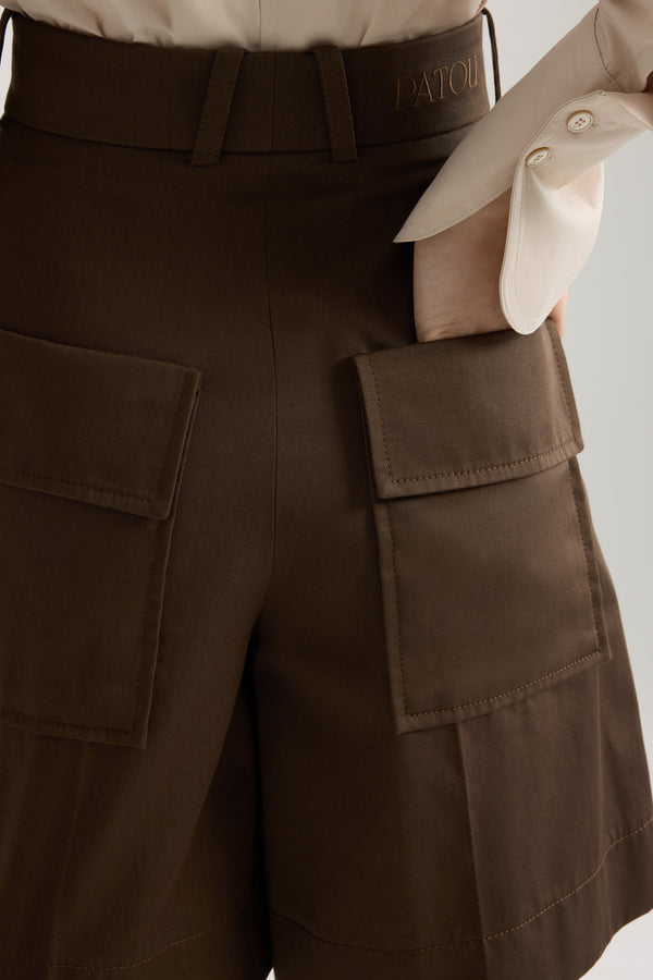 Patou - Bermudas in organic cotton gabardine - Java Brown - Java Brown organic cotton gabardine bermudas. High rise. Belt loops. Fastens via a gold-tone JP monogram-engraved button and concealed zip at the front. Pressed creases at the front. Patch pockets at the back. Embroidered Patou logo on the waistband.