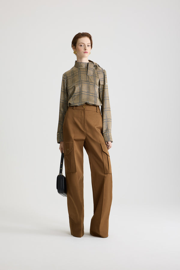 Patou - Flared cargo trousers in organic cotton gabardine - Nutmeg - Nutmeg light brown organic cotton gabardine trousers. Long flared leg. Gold-tone JP monogram-engraved button and concealed zip at the front. Belt loops. Pockets at the sides; cargo pockets on the legs with gold-tone JP monogram-engraved snap buttons. Stitched crease at the front and back.