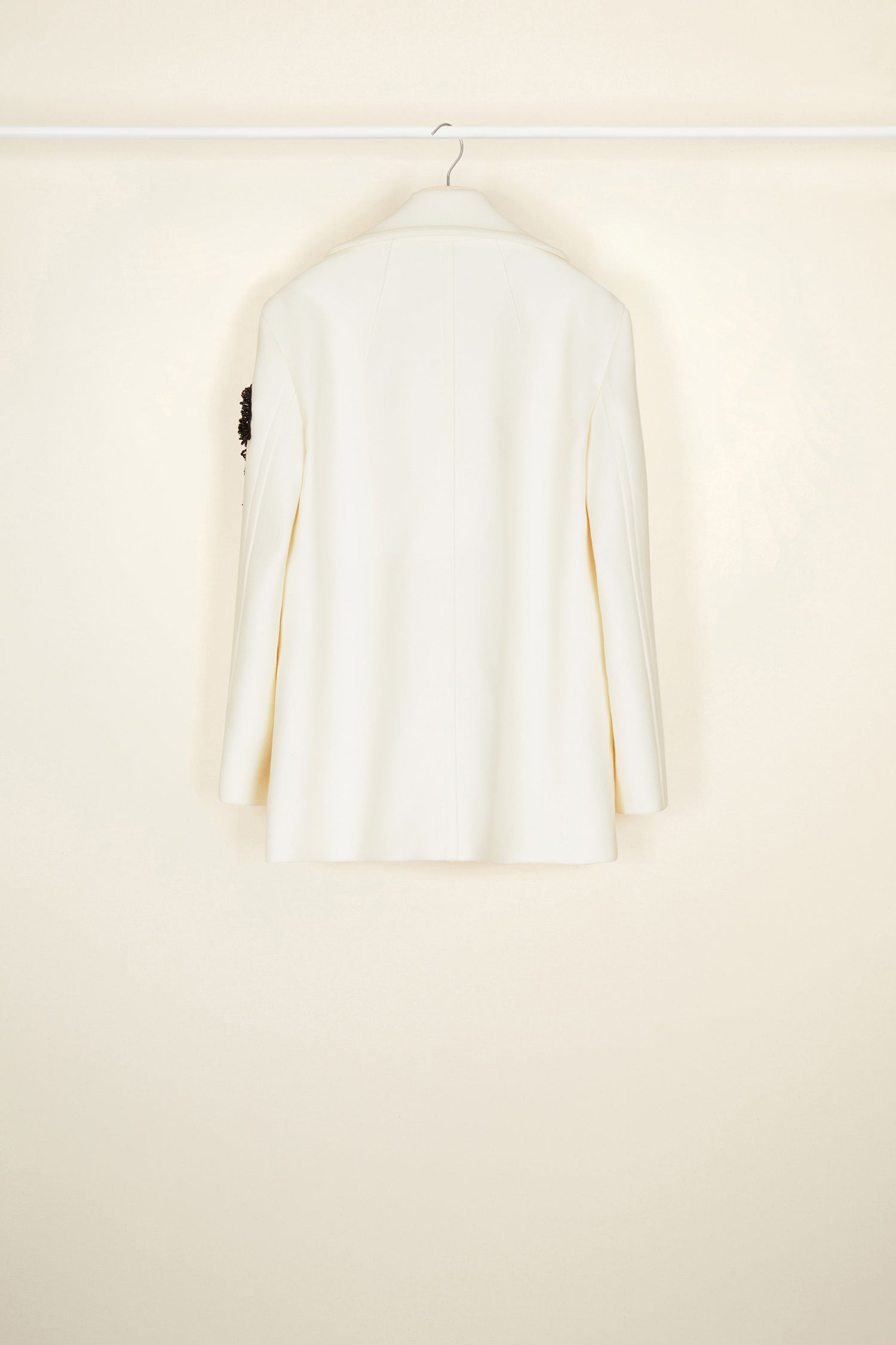 Patou - Jewelled logo peacoat - Pearl - The logo, a signature and an embellishment.Pearl white virgin wool peacoat. Double-breasted style with exaggerated lapels. JP logo in black pearls on the left sleeve. Contrasting black buttons. Welt pockets. Fully lined.