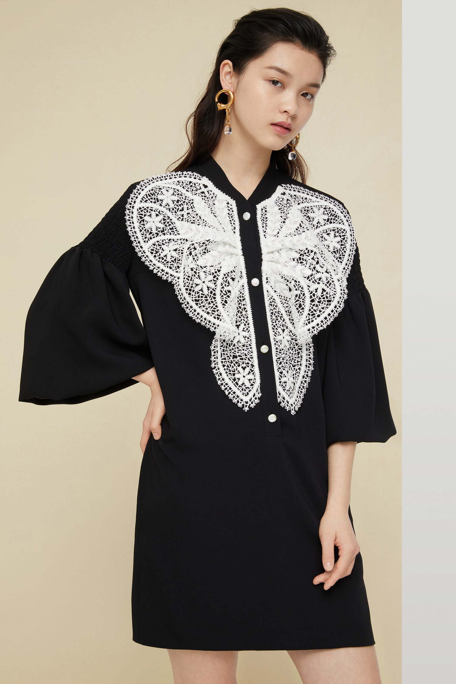 Patou - Lace bib dress - Black - The day dress is best worn with a touch of lace.Black cady dress with white lace bib. Mother-of-pearl buttons down the front. Long sleeves, smocked at the top with elasticated cuffs. Pockets at the sides.