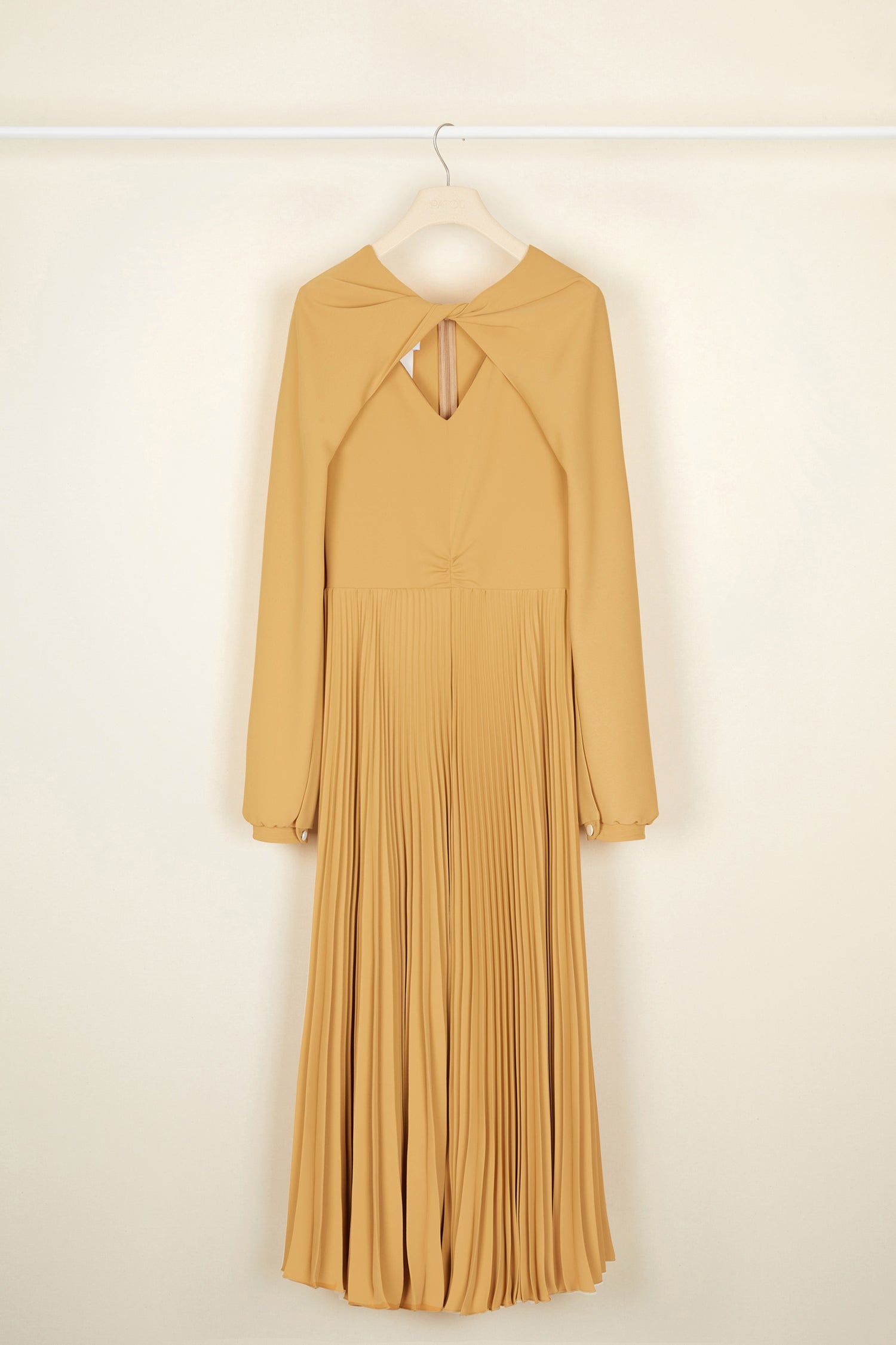 Patou - Twisted neckline pleated midi dress - Sand - Twisting and pleating. Sand-coloured cady midi dress. Long sleeves twisted at the collar over a V neckline. Zip fastening at the back. Ruched detailing at the front. Mother-of-pearl buttons at the cuffs. Pleated skirt.