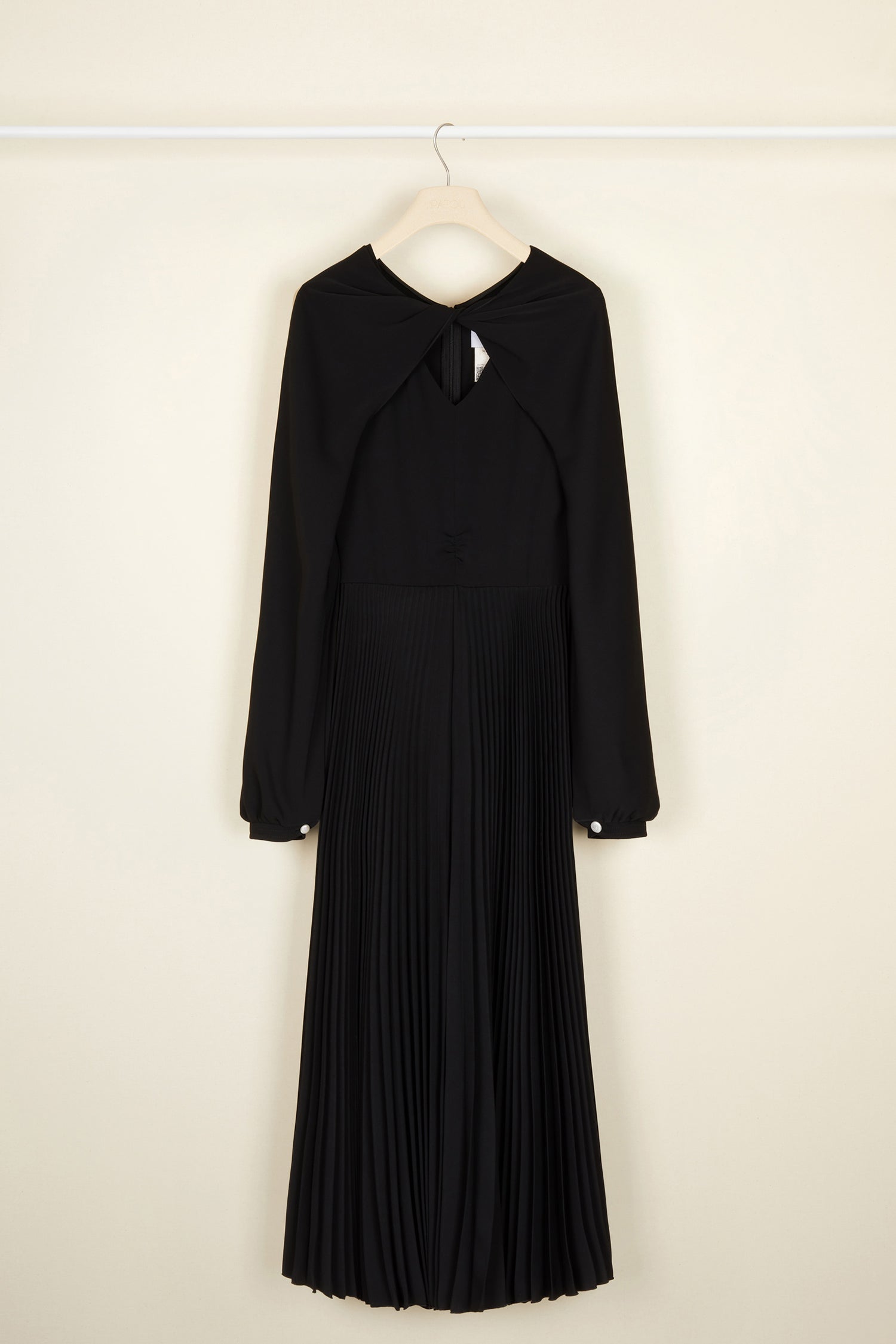 Patou - Twisted neckline pleated midi dress - Black - Twisting and pleating. Black cady midi dress. Long sleeves twisted at the collar over a V neckline. Zip fastening at the back. Ruched detailing at the front. Mother-of-pearl buttons at the cuffs. Pleated skirt.