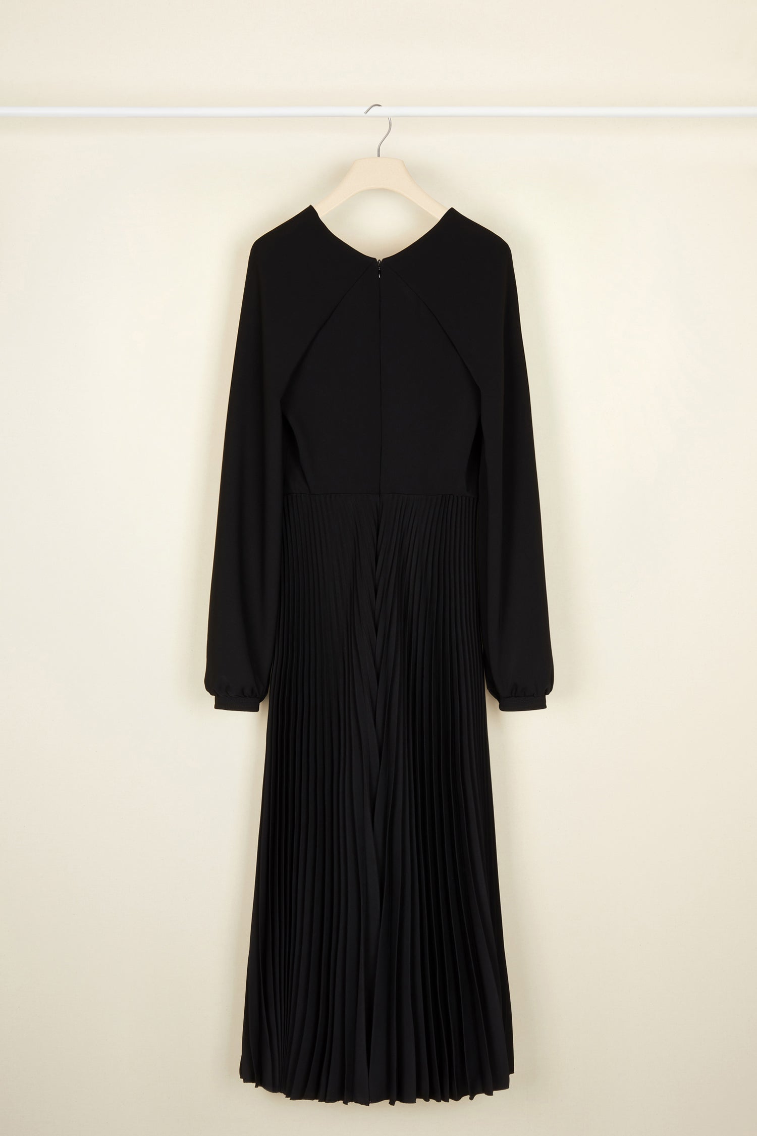 Patou - Twisted neckline pleated midi dress - Black - Twisting and pleating. Black cady midi dress. Long sleeves twisted at the collar over a V neckline. Zip fastening at the back. Ruched detailing at the front. Mother-of-pearl buttons at the cuffs. Pleated skirt.