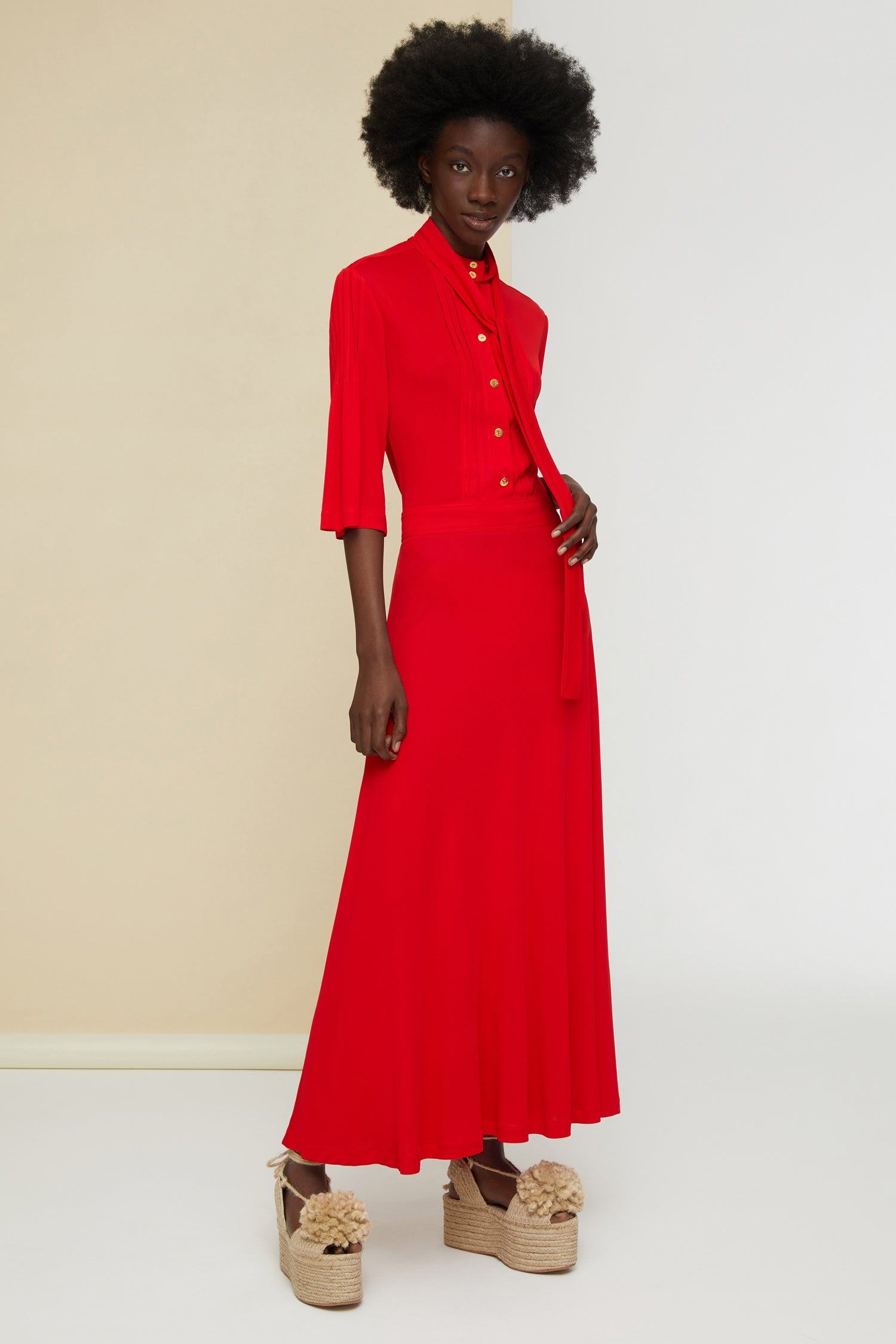 Patou - Necktie midi dress - Poppy - Pleats and ties and gold accents.Poppy red jersey dress. High collar with long ties around the neck. Micropleating down the bodice. Gold-coloured buttons at the front. Cropped sleeves. Midi skirt with pockets and buttons at the sides. Side pockets. Concealed side zip.