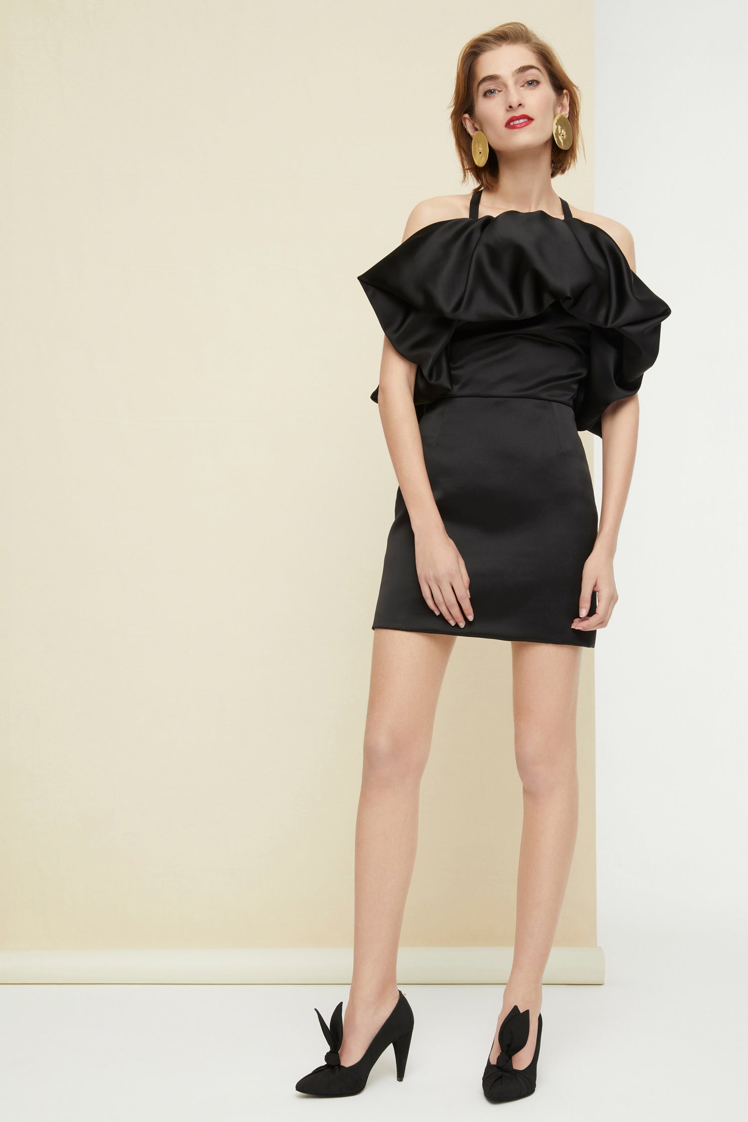 Patou - Oversized ruffle minidress - Black - The distinctive drama of ruffles.Black satin minidress with an oversized ruffle across the neckline and back. Two straps that cross at the back. Concealed side zip.