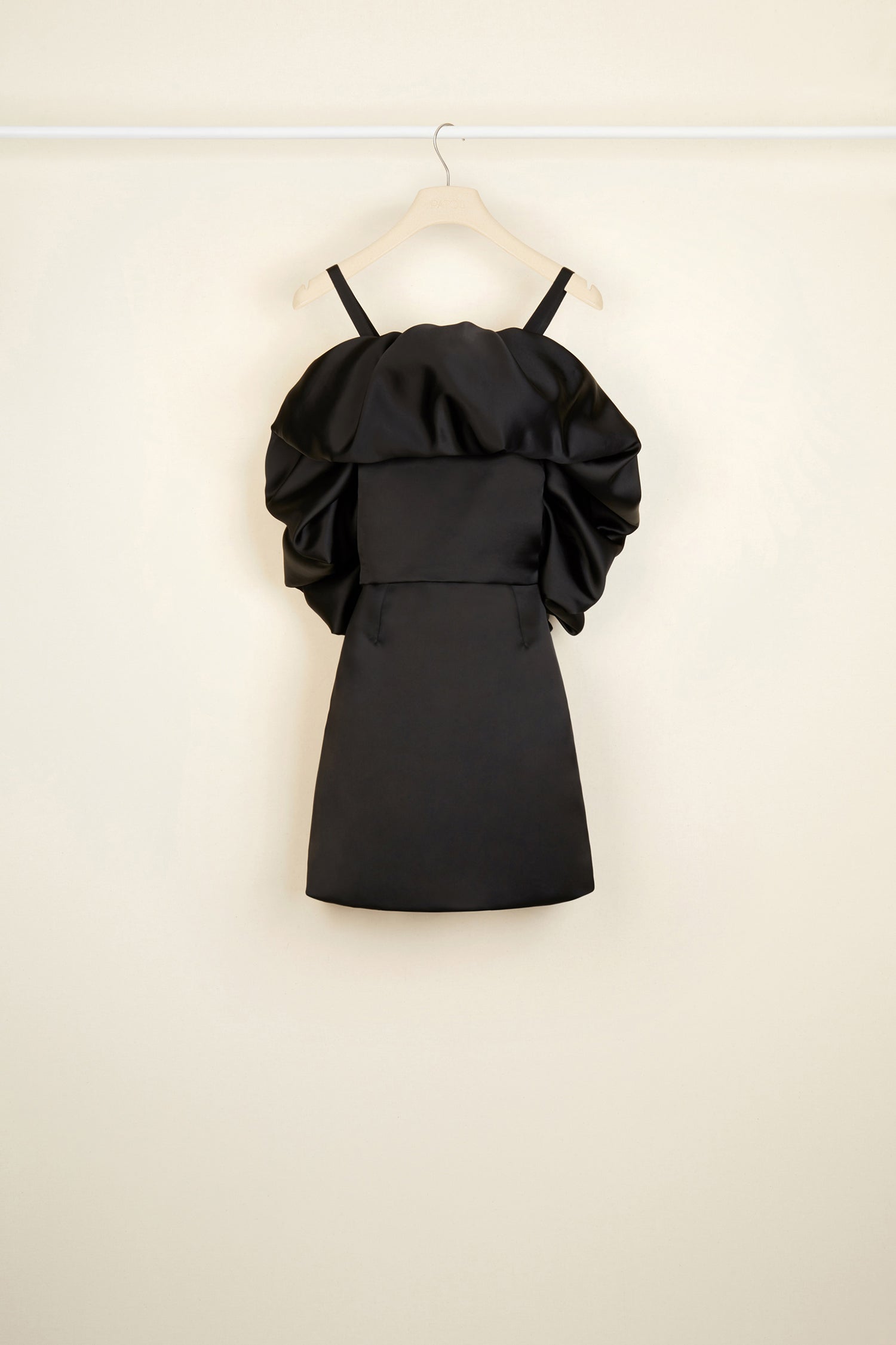 Patou - Oversized ruffle minidress - Black - The distinctive drama of ruffles.Black satin minidress with an oversized ruffle across the neckline and back. Two straps that cross at the back. Concealed side zip.