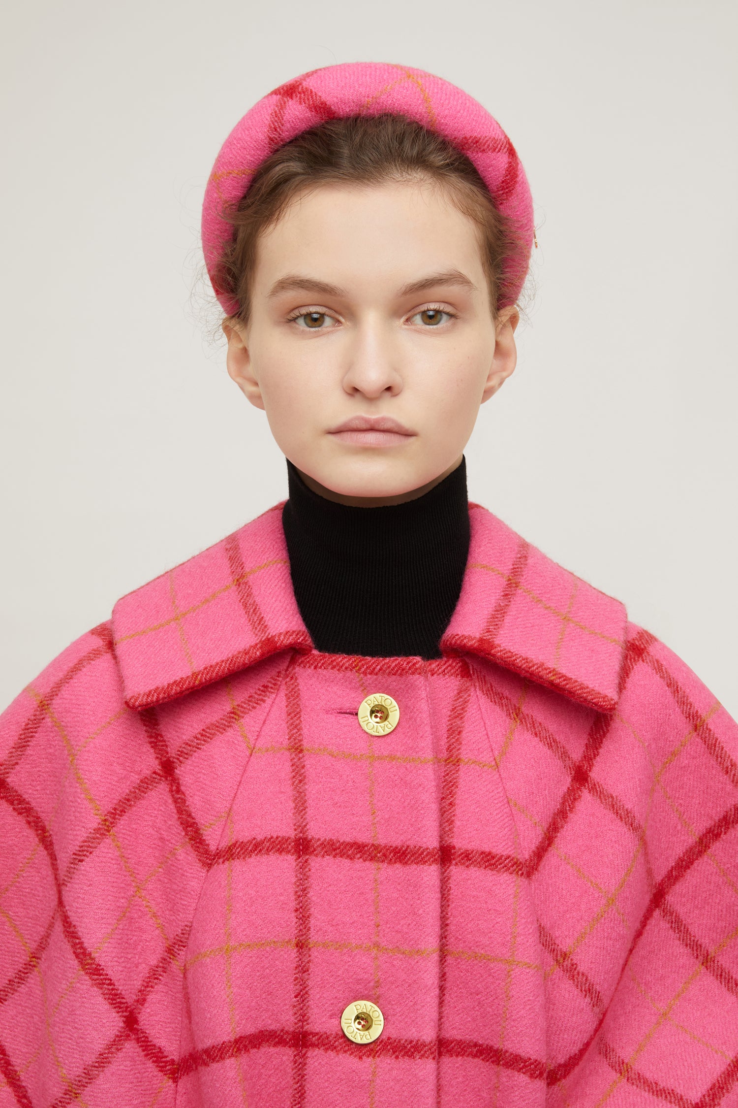 Patou - Padded headband in checked wool - Pink Checkerboard - A bright wool crown fit for modern-day royalty.Virgin wool headband featuring a Pink Checkerboard pattern. Thick padded style. Gold-coloured JP logo. Grosgrain-lined underside with embroidered Patou label.