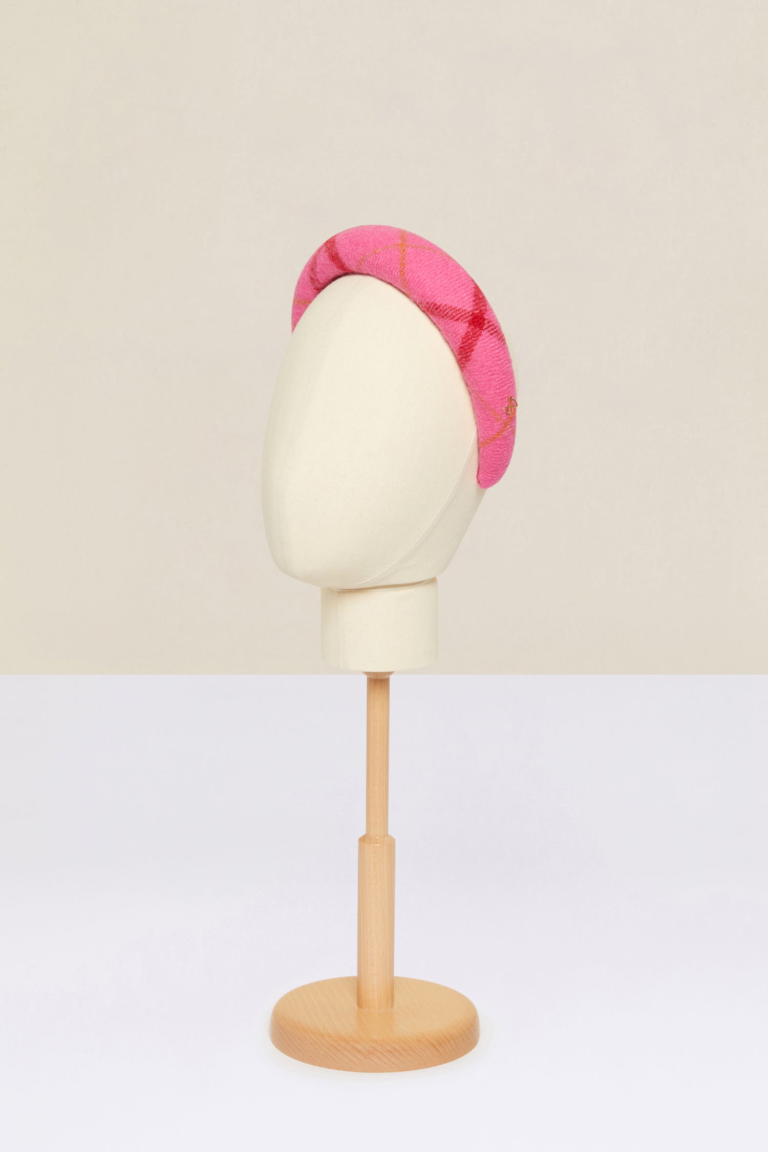 Patou - Padded headband in checked wool - Pink Checkerboard - A bright wool crown fit for modern-day royalty.Virgin wool headband featuring a Pink Checkerboard pattern. Thick padded style. Gold-coloured JP logo. Grosgrain-lined underside with embroidered Patou label.