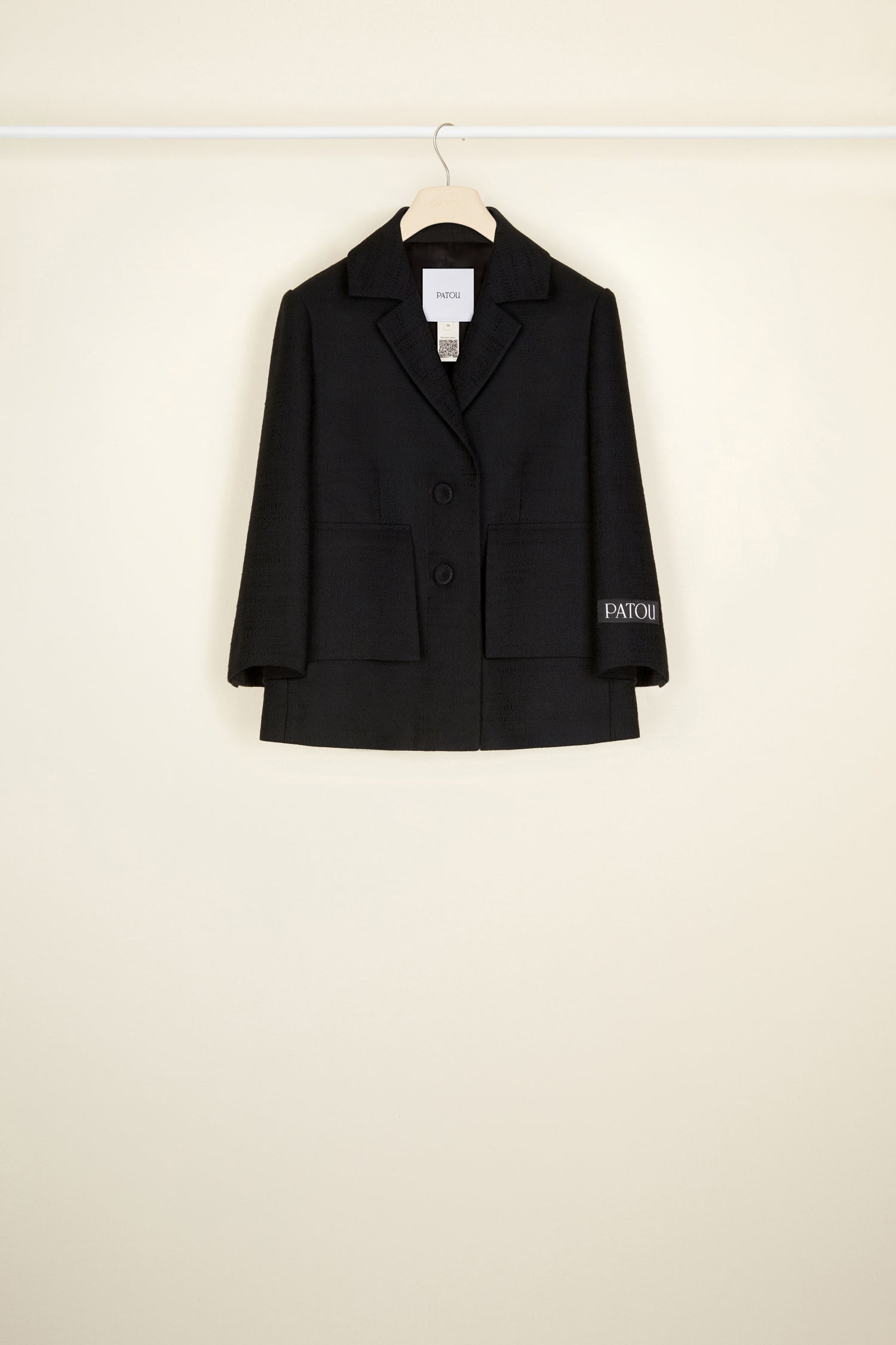 Patou - Box jacket in organic tweed - Black - Cropped and tweaked, classic tailoring with a Patou point of view. Black cotton and wool tweed jacket. Box silhouette with single vent at the back. Single-breasted style with two fabric-covered buttons at the front. Black Patou label on the left sleeve. Mock flap pockets at the front. Fully lined.