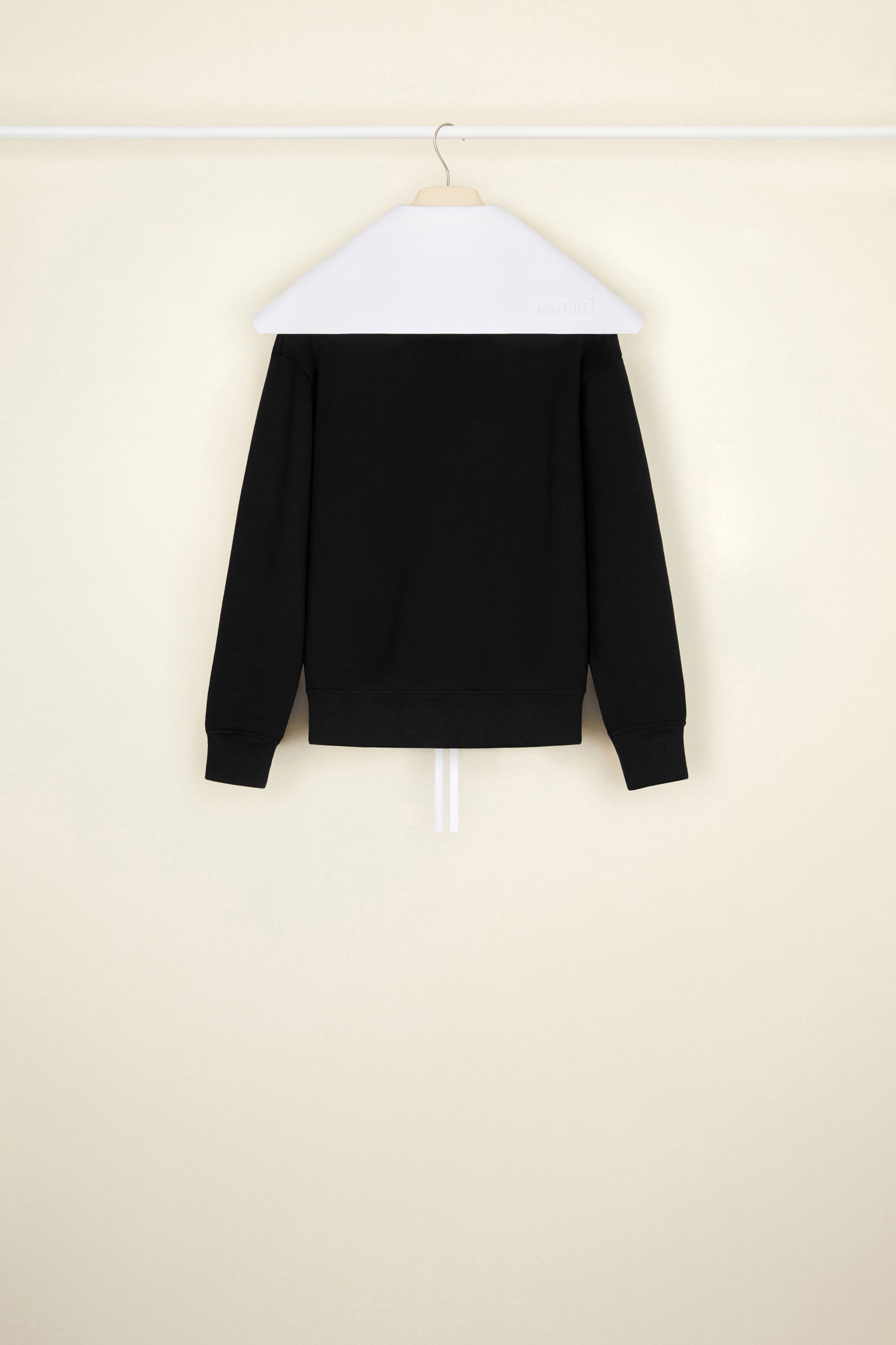 Patou - Organic cotton sweatshirt with a detachable collar - Black - A poplin collar, a Patou signature that makes everything chicer.Black organic cotton sweatshirt. Removable organic cotton poplin collar that fastens via long ties at the front. Embroidered Patou label on the left sleeve.
