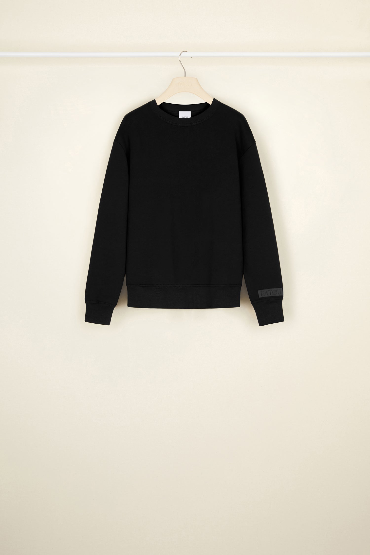 Patou - Organic cotton sweatshirt with a detachable collar - Black - A poplin collar, a Patou signature that makes everything chicer.Black organic cotton sweatshirt. Removable organic cotton poplin collar that fastens via long ties at the front. Embroidered Patou label on the left sleeve.