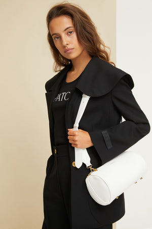 Barrel bag in faux leather
