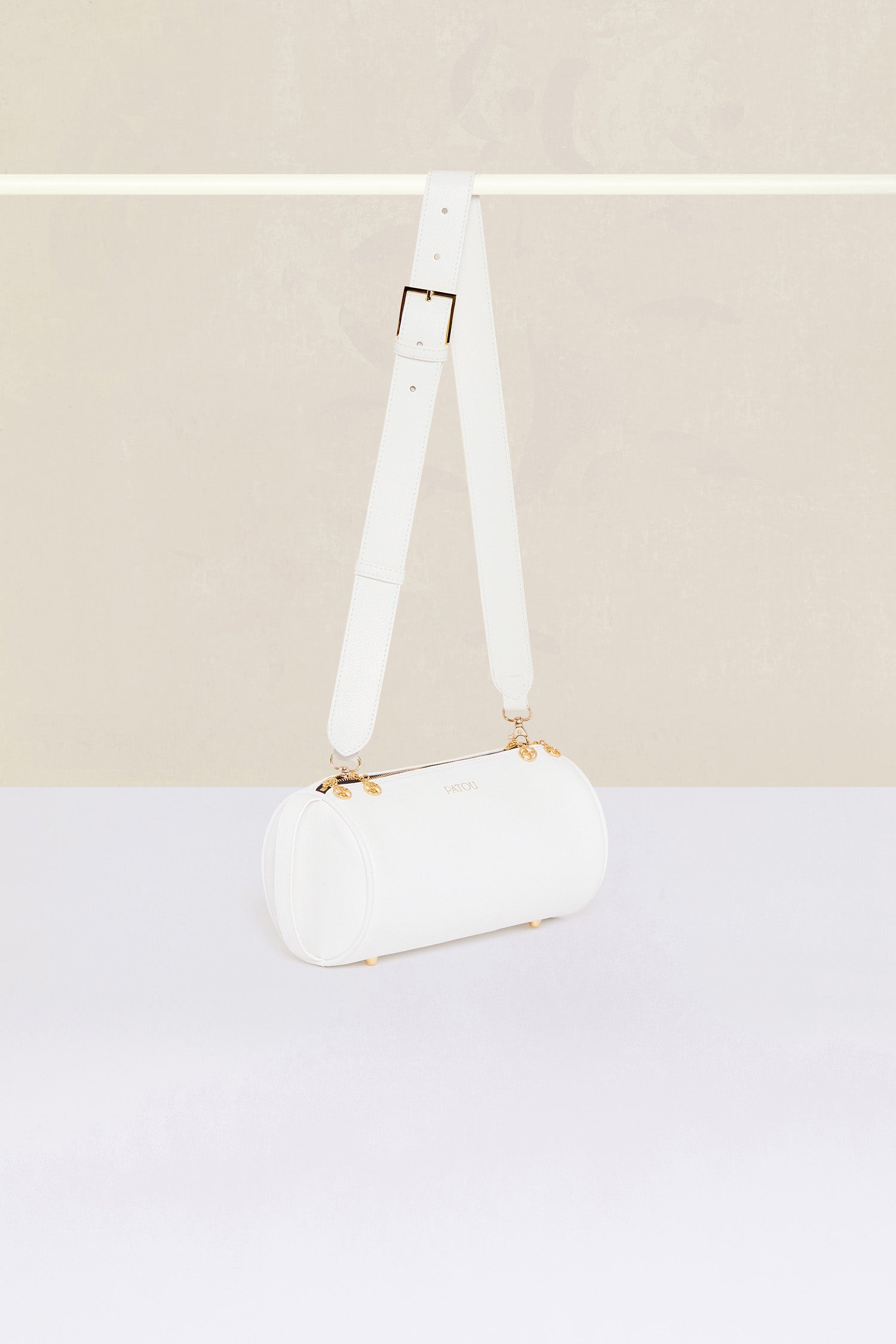 Patou - Barrel bag in faux leather - White - Meet the Patou bag: functional and whimsical, a new design for the everyday.White faux leather handbag. Barrel shape inspired by a pétanque bag. Adjustable strap that can be worn short or long. Gold-coloured hardware. Multiple zip tabs with JP logo inspired by a heritage keyring. Patou lettering logo. Small pocket inside.