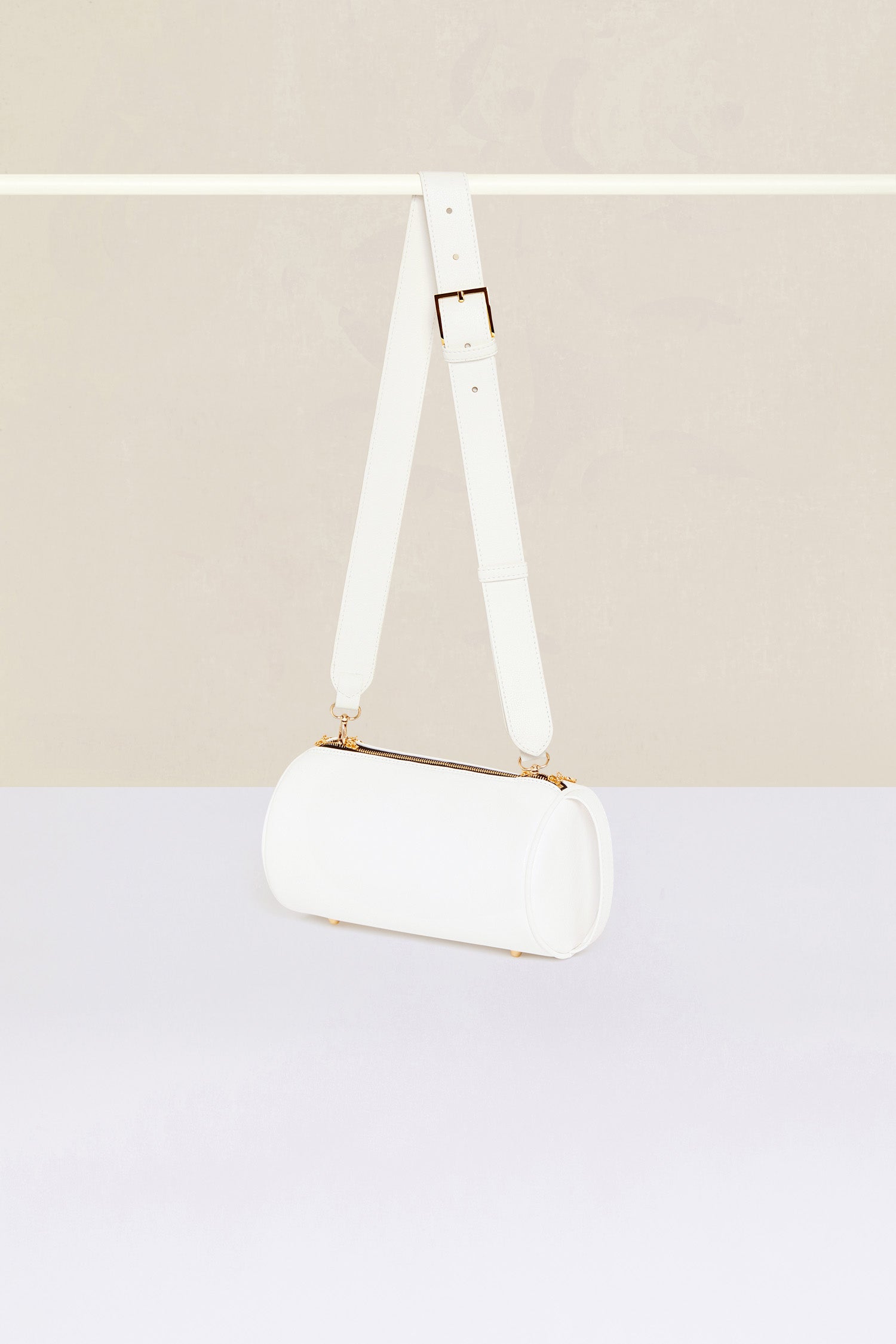 Patou - Barrel bag in faux leather - White - Meet the Patou bag: functional and whimsical, a new design for the everyday.White faux leather handbag. Barrel shape inspired by a pétanque bag. Adjustable strap that can be worn short or long. Gold-coloured hardware. Multiple zip tabs with JP logo inspired by a heritage keyring. Patou lettering logo. Small pocket inside.