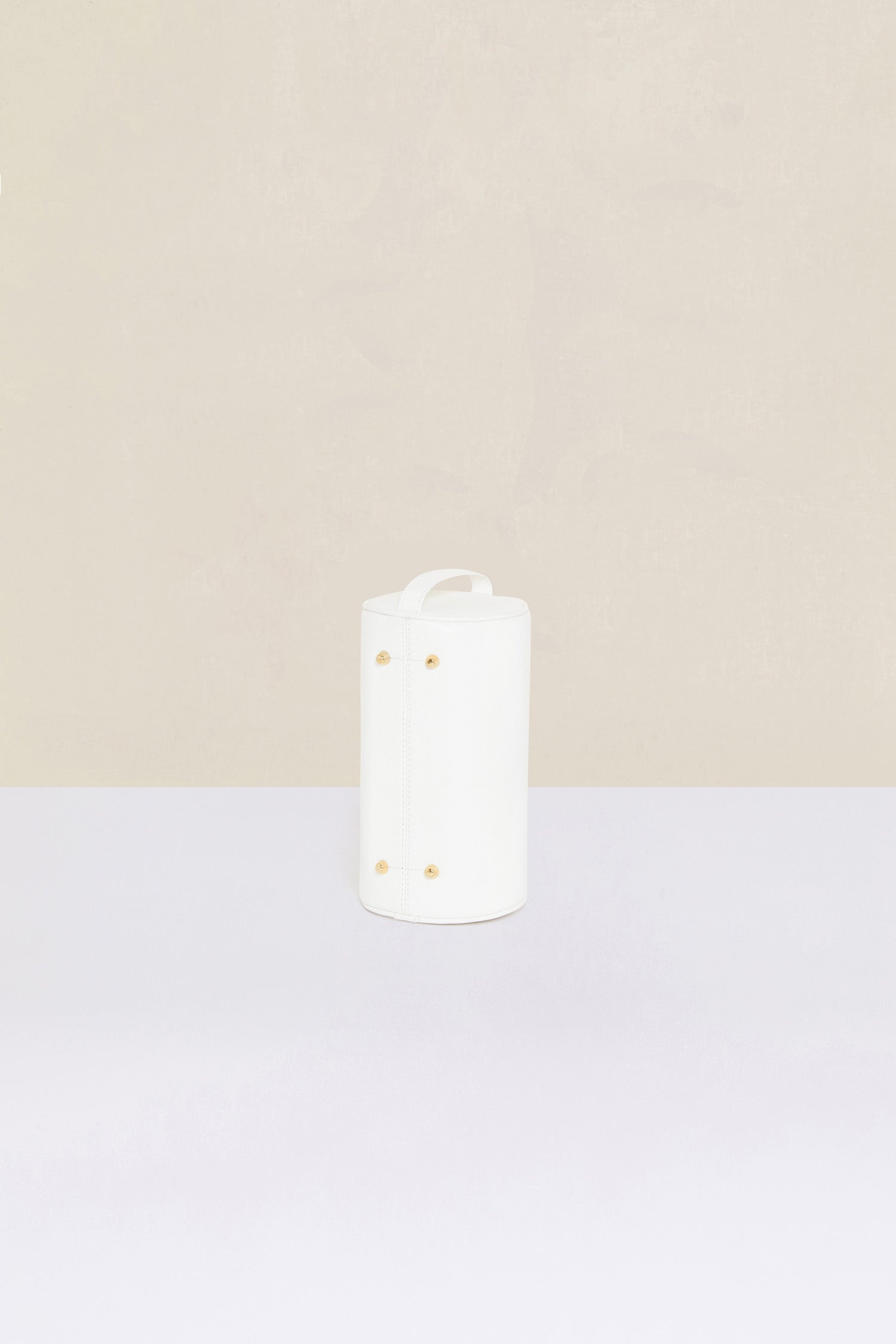 Patou - Barrel bag in faux leather - White - Meet the Patou bag: functional and whimsical, a new design for the everyday.White faux leather handbag. Barrel shape inspired by a pétanque bag. Adjustable strap that can be worn short or long. Gold-coloured hardware. Multiple zip tabs with JP logo inspired by a heritage keyring. Patou lettering logo. Small pocket inside.