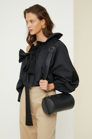 Barrel bag in faux leather