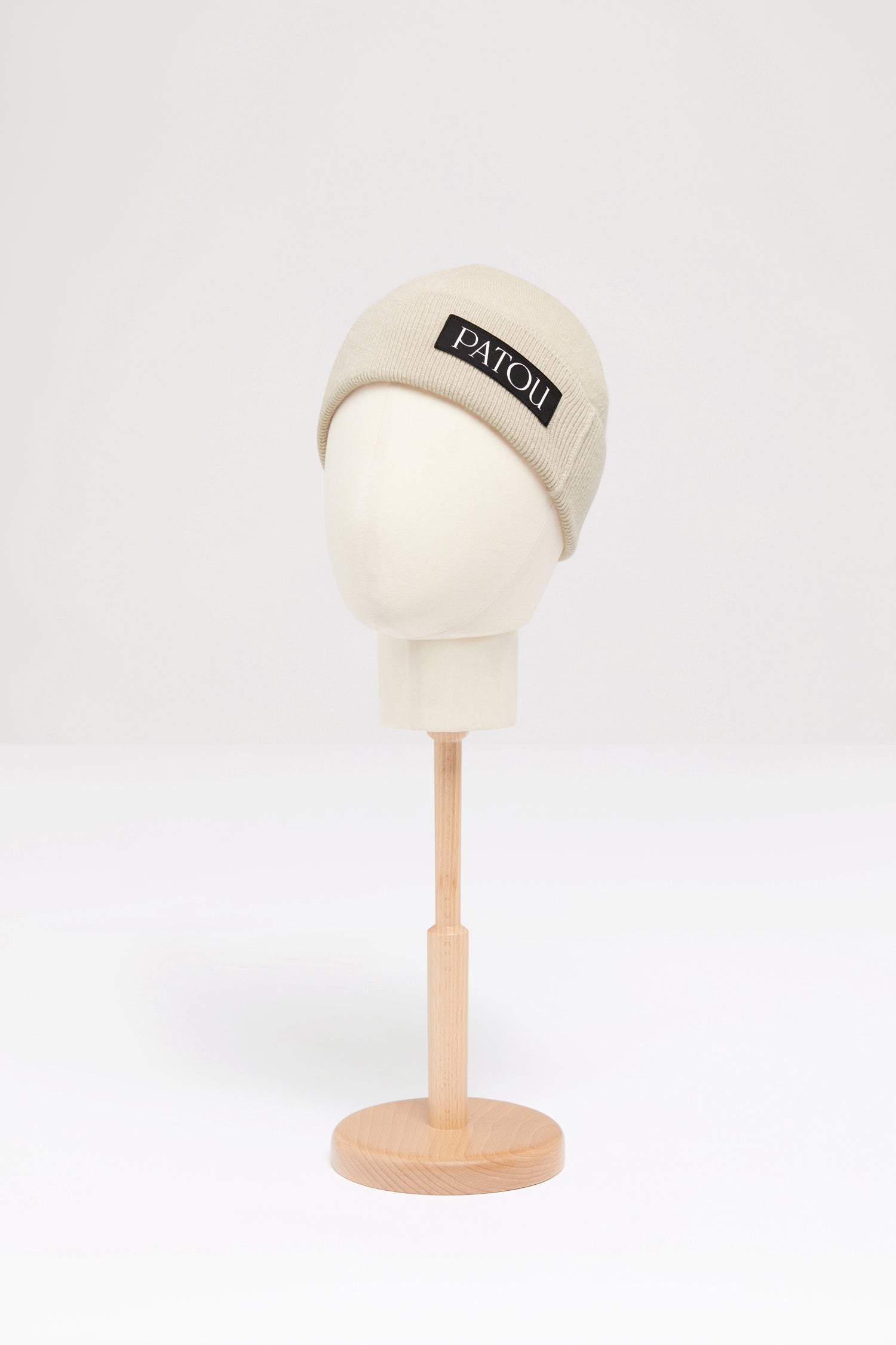 Patou - Fragrance wool beanie - Biscuit - The scent of an icon.Biscuit beige wool beanie. Perfume bottle intarsia inspired by the Jean Patou archive.