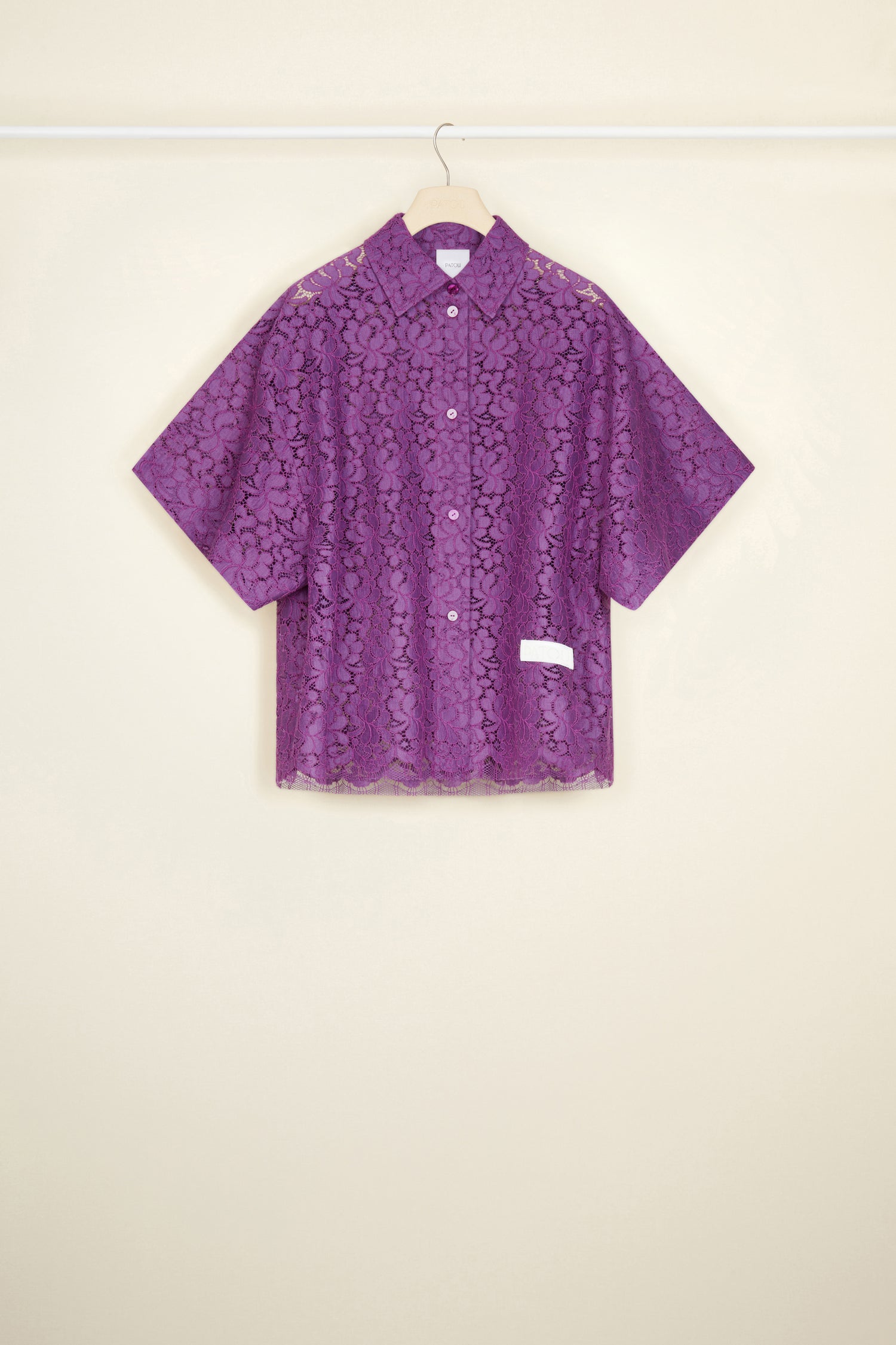 Patou - Short-sleeved shirt in eco-friendly lace - Anemone - Eco-friendly lace is best worn with a smile on your face.Anemone purple eco-friendly lace shirt. Oversized silhouette. Classic shirt collar. Button fastening with JP engraved buttons. Short sleeves. Embroidered Patou label in white at the front.