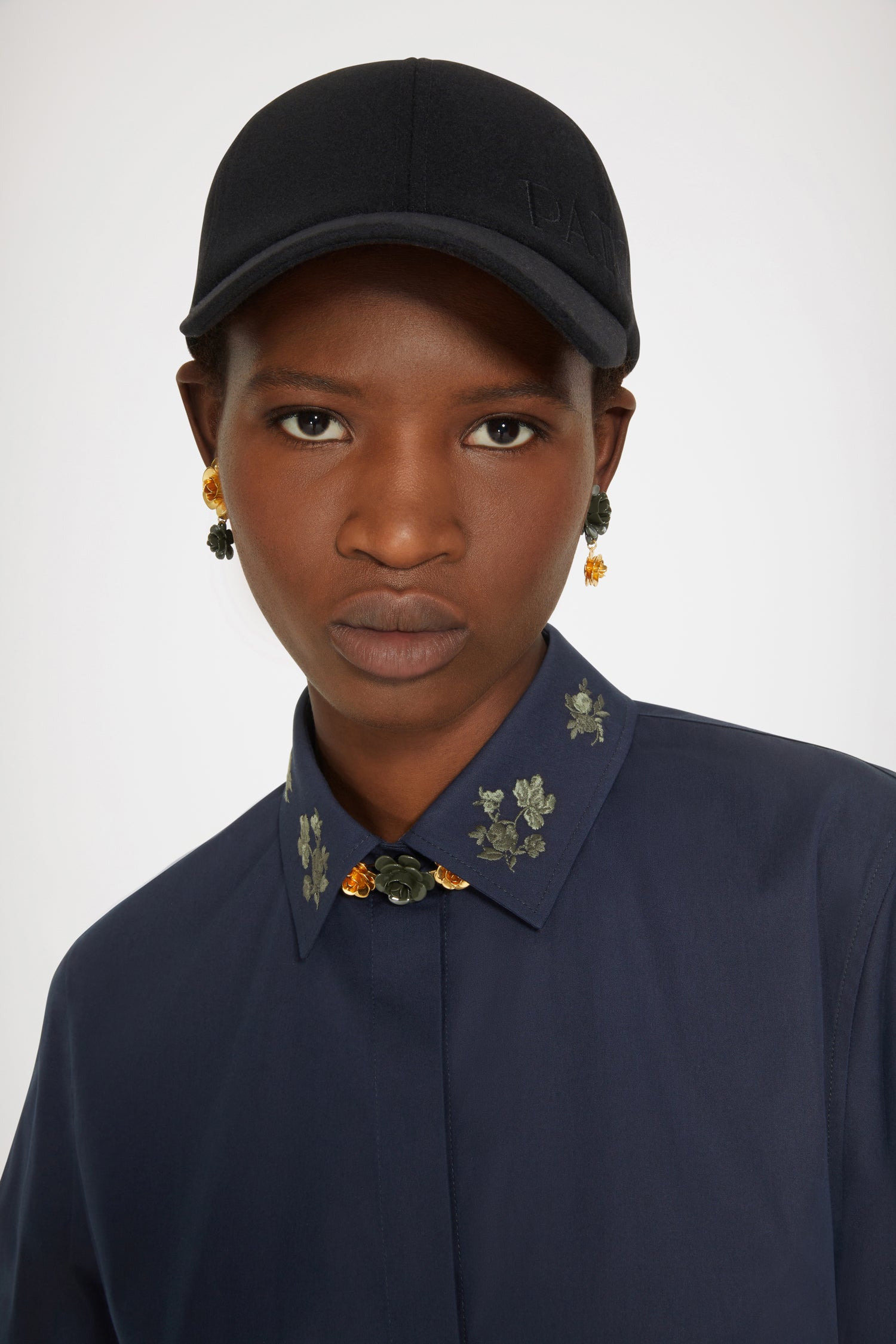 Patou - Signature organic cotton shirt with embroidered collar - Parisian Night - Embroidery is Patou&amp;#39;s love language. Parisian Night navy cotton shirt. Signature longline silhouette. Embroidered collar with floral motifs. Concealed button fastening at the front. Buttoned cuffs. Patou logo embroidered on the left cuff. Split sides.