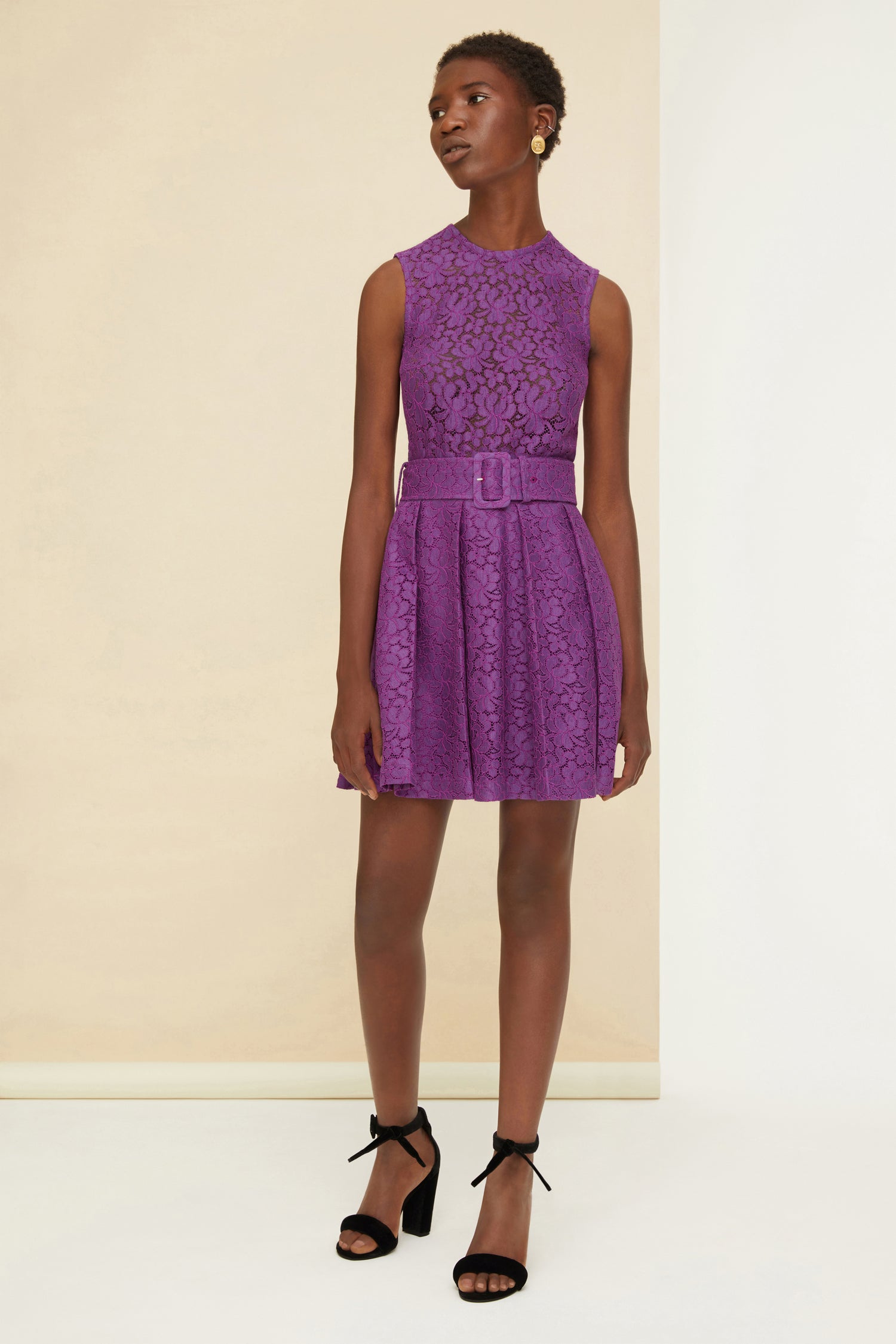 Patou - Pleated mini dress in eco lace - Anemone - The sweet embrace of Patou eco lace. Anemone purple eco lace dress. Short length. Fit and flare silhouette. Round neckline. Zip fastening at the back. Sleeveless style. Wide adjustable belt at the waist with fabric-covered buckle. Comes with a separate slip dress in a matching colour.