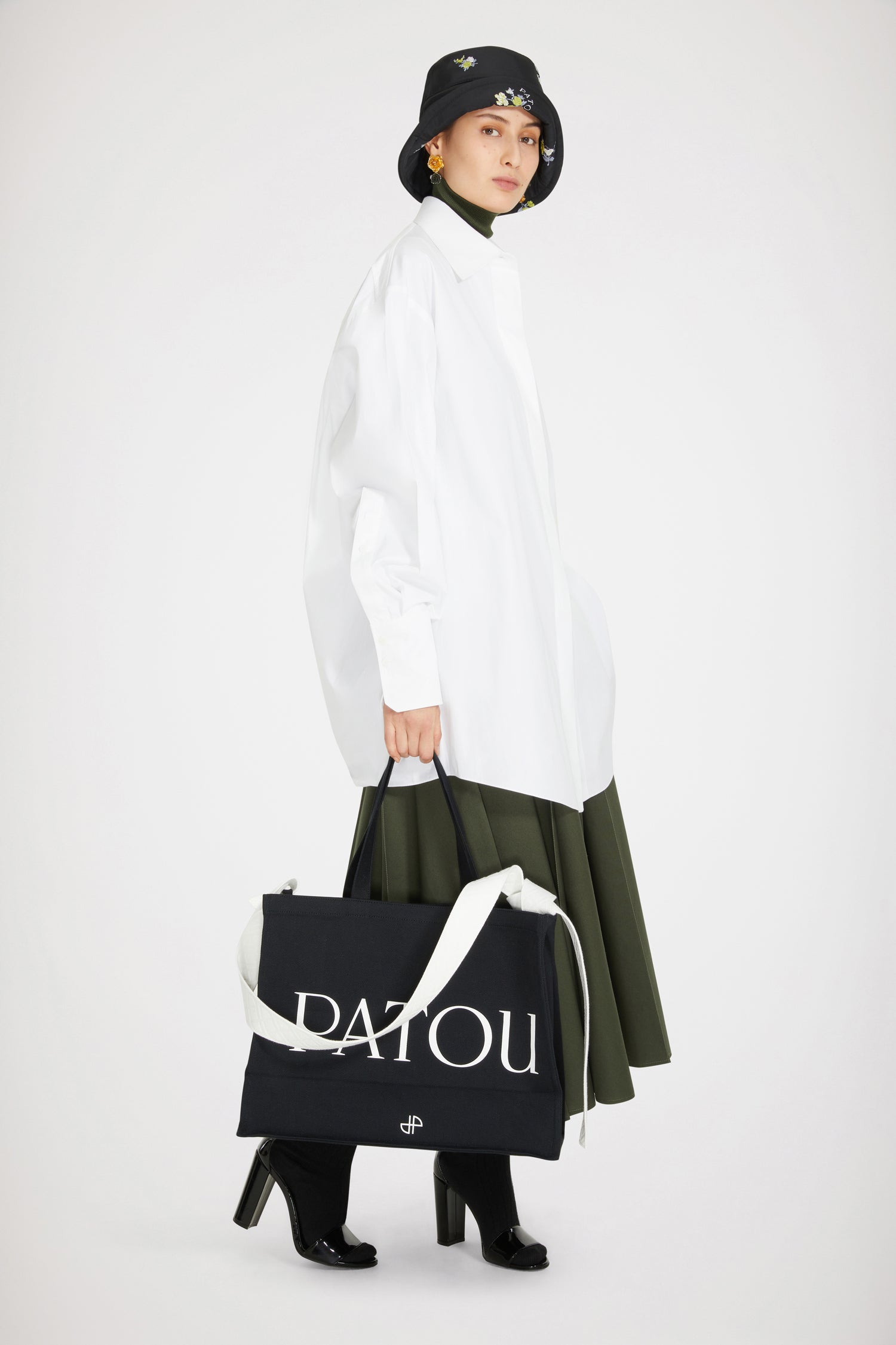 Patou - Mini shirt dress in organic cotton - White - Long shirt or short dress? There are two sides to every Patou story!White organic cotton dress. Short hemline. Concealed button fastening. Patou logo embroidered at the front. Buttoned cuffs.  Loose fit (select one size down for a fitted look).