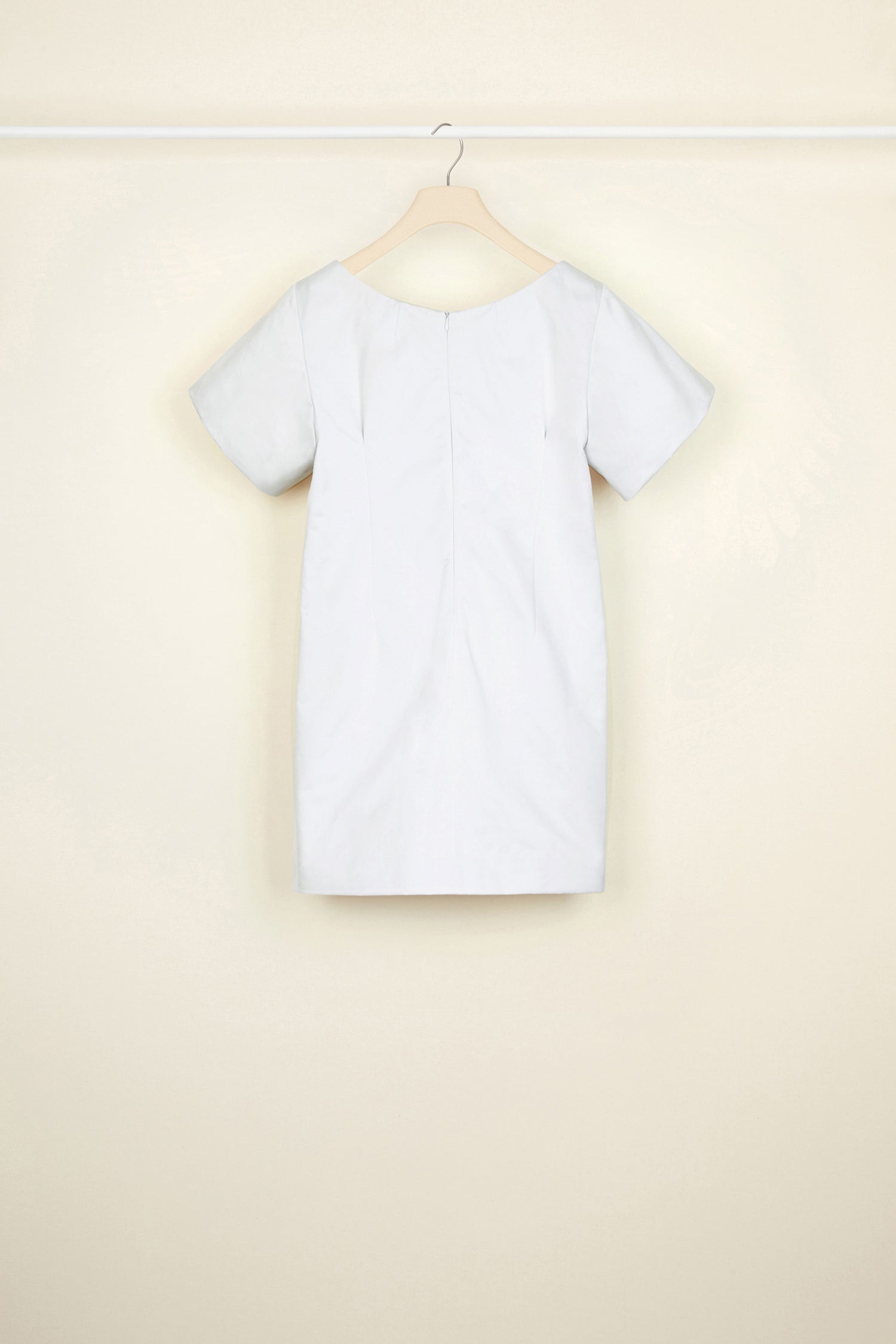 Patou - Bow cotton mini dress - Light Grey - The understated bow.Light grey eco-conscious cotton satin mini dress. Round neckline with small cut-out. Short sleeves. Two flat bows at the front. Zip fastening at the back. Pockets at the sides.