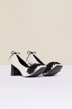 Décolleté in tweed con perle