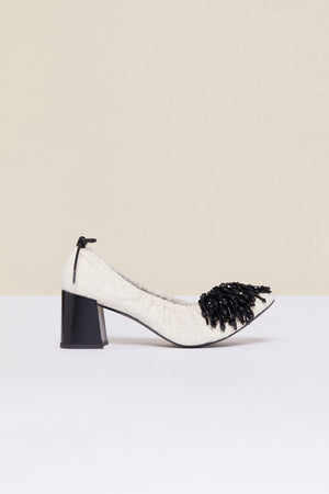 Décolleté in tweed con perle