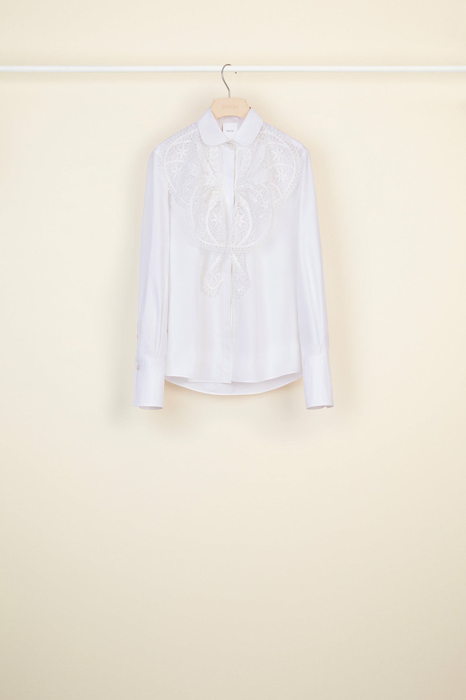 Patou - Lace bib shirt - White - The sheer seduction of guipure lace.White cotton poplin shirt with white floral lace bib at the front. Classic shirt collar and concealed button fastening. Buttoned cuffs.