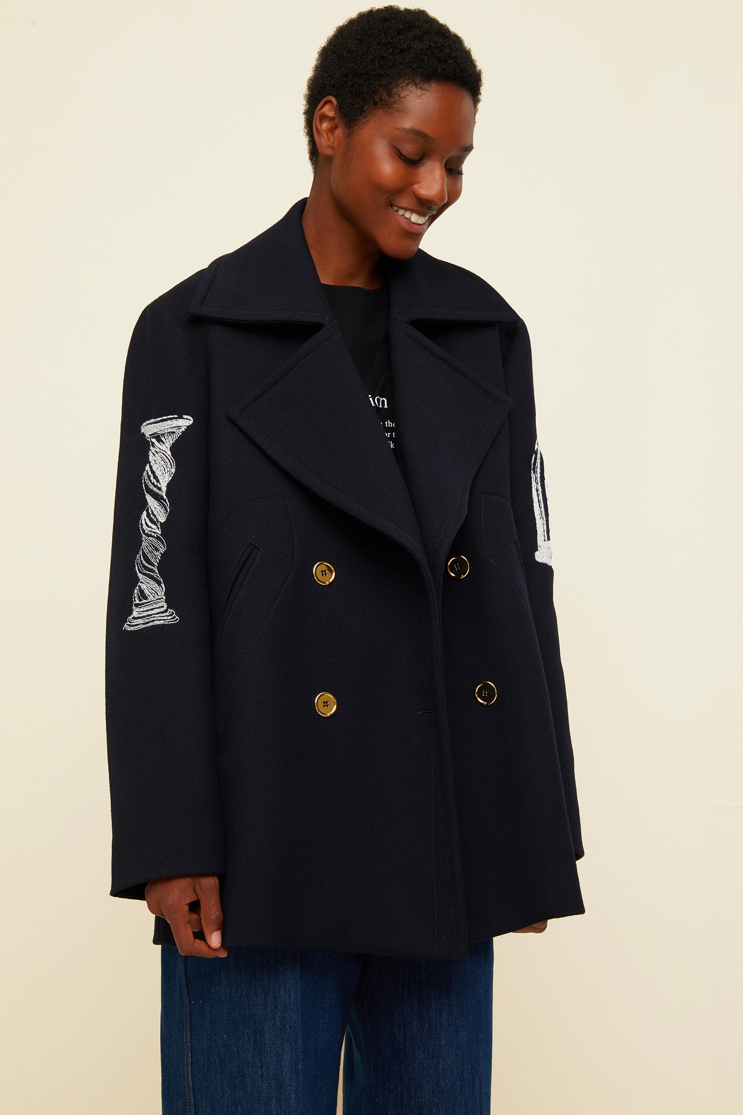 Patou - Oversized embroidered virgin wool peacoat - Navy - A day coat with a touch of fantasy!  Navy virgin wool peacoat. Double-breasted style with exaggerated lapels. Embroidered with white Patou heritage motifs (perfume bottle, Greek column). Gold-coloured buttons and gold embroidered logo on the sleeve. Slit pockets at the sides. Fully lined.