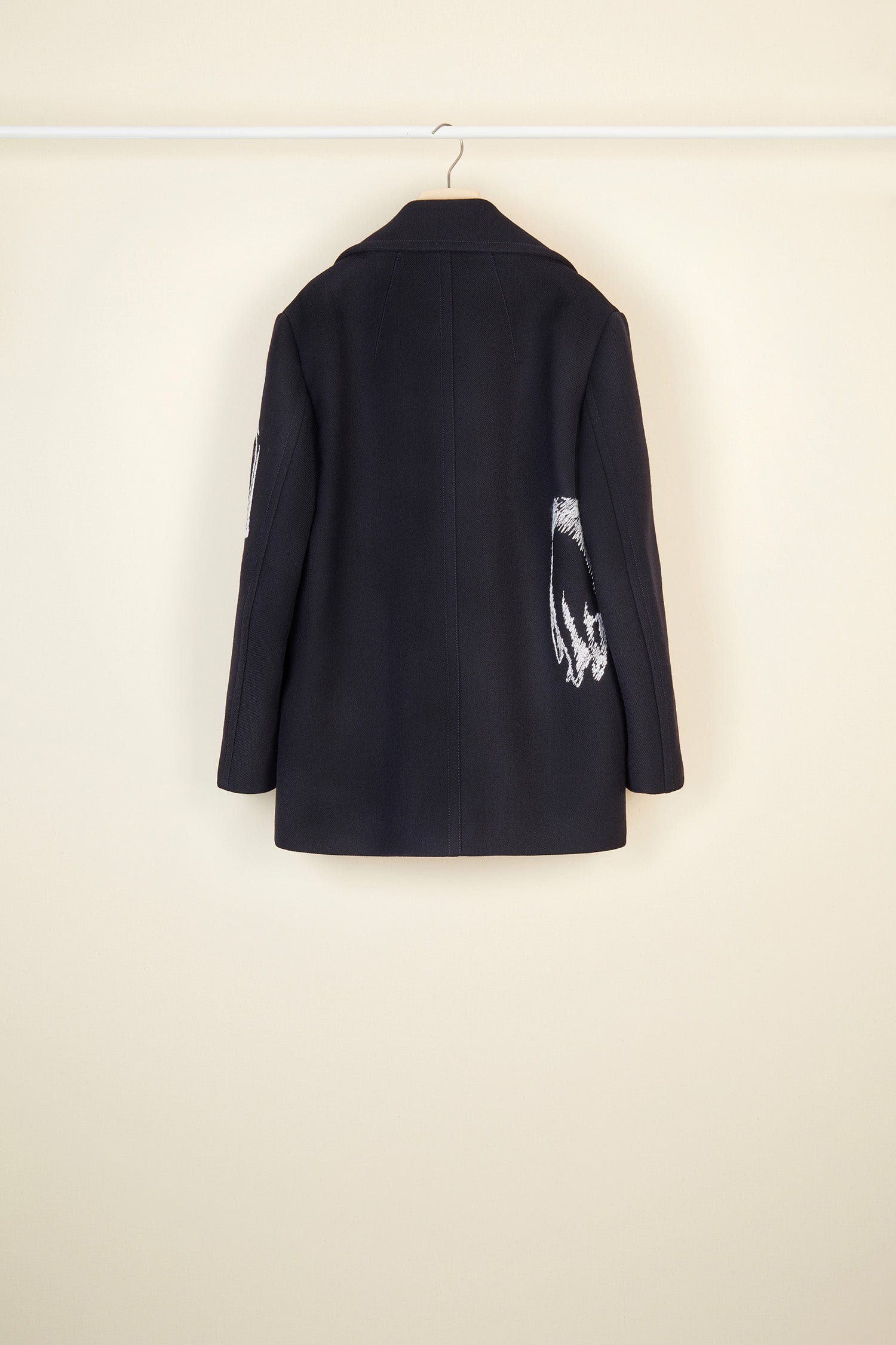 Patou - Oversized embroidered virgin wool peacoat - Navy - A day coat with a touch of fantasy!  Navy virgin wool peacoat. Double-breasted style with exaggerated lapels. Embroidered with white Patou heritage motifs (perfume bottle, Greek column). Gold-coloured buttons and gold embroidered logo on the sleeve. Slit pockets at the sides. Fully lined.