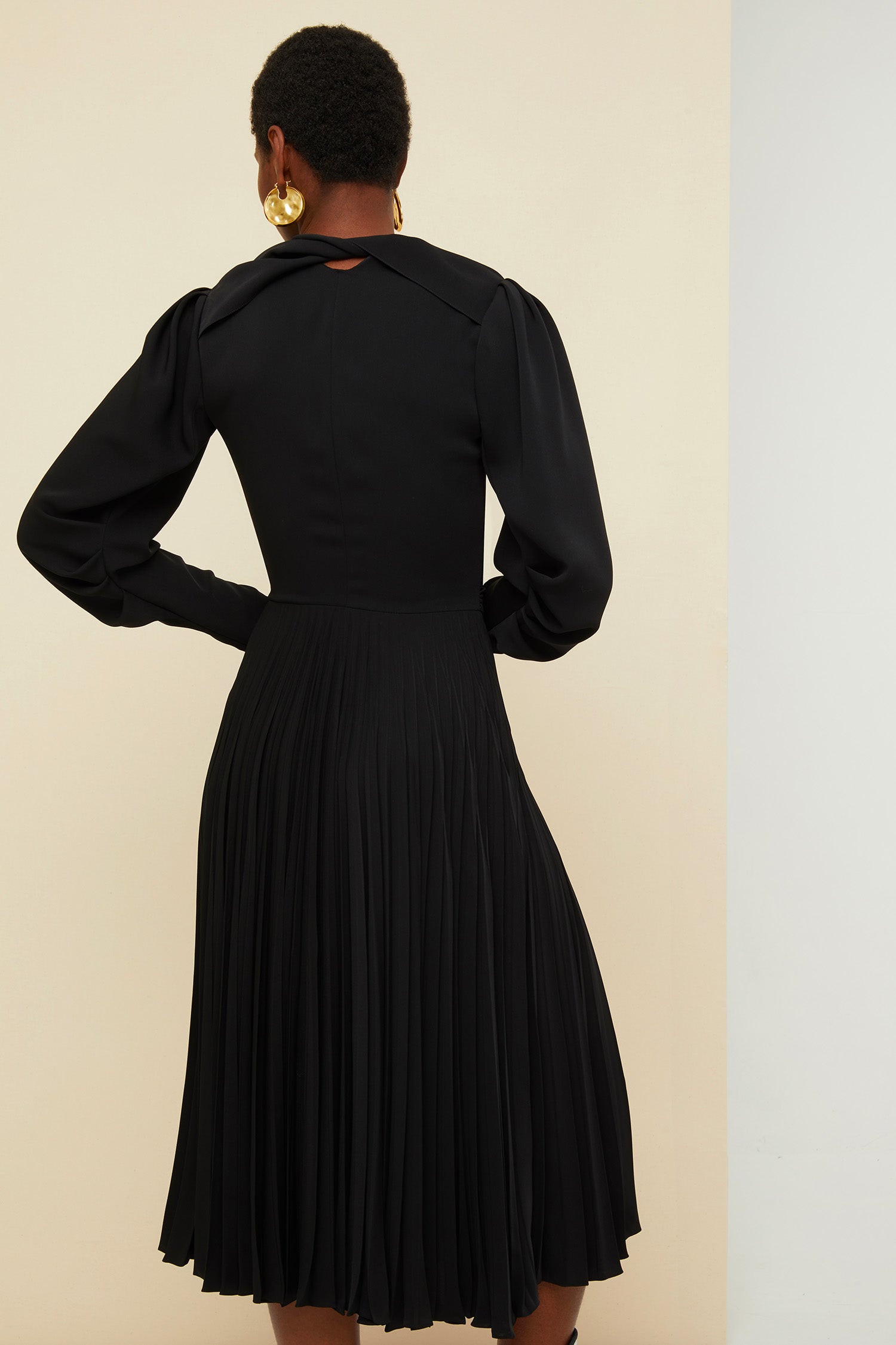 Patou - Twisted collar pleated dress - Black - Twists and turns and pleats.  Black cady midi dress. Deep V neckline, twisted cut-out collar at the back. Shirred detailing at the front. Long dolman sleeves with shirred elbows and zipped cuffs. Fully lined.