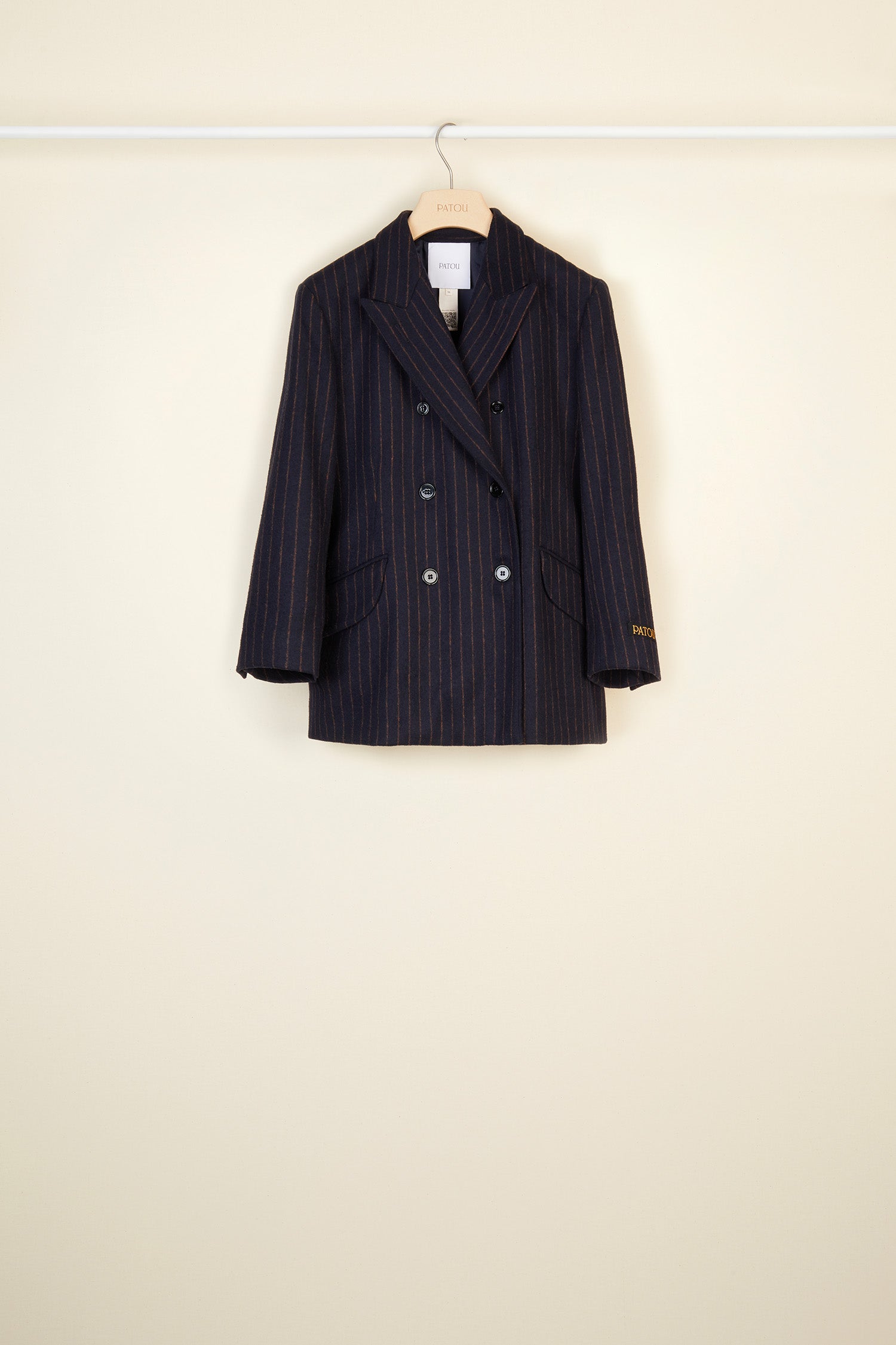 Patou - Double-breasted chalk stripe wool jacket - Navy Sienna - The allure of stripes.  Double-breasted navy and burnt sienna chalk stripe wool jacket. Buttons at the front and on the cuffs. Tailor-style Patou label on the sleeve. Two flap pockets at the front, one internal pocket. Single high vent at the back with button fastening. Fully lined. Brooches sold separately.