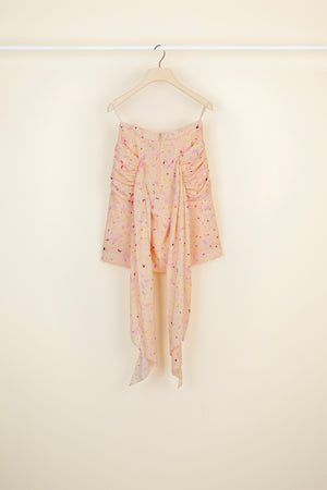 Jupe en soie imprimée à pans drapés