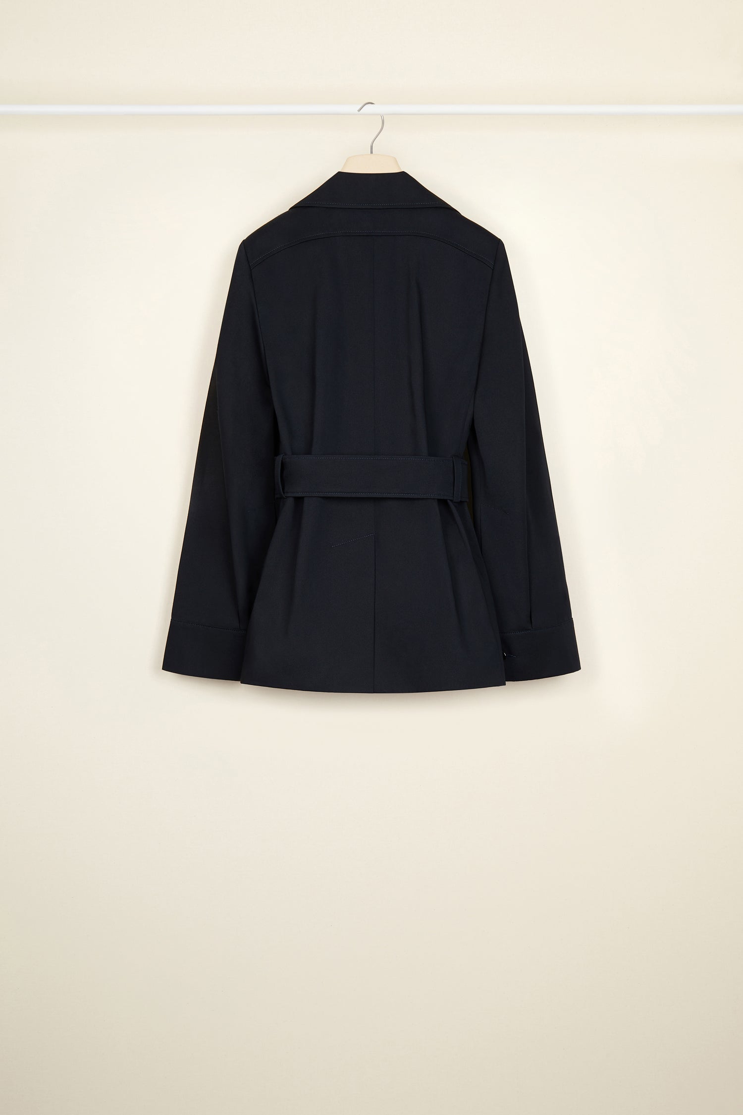 Patou - Belted jacket in organic cotton - Night Blue - Belted and flared: tailoring with the Patou touch.Night blue organic cotton jacket. Slightly flared silhouette. Spread collar. Button fastening down the front. Long sleeves with wide cuffs. Patou lettering logo embroidered on the left cuff. Wide fabric belt with adjustable buckle. Pockets at the sides. Fully lined.