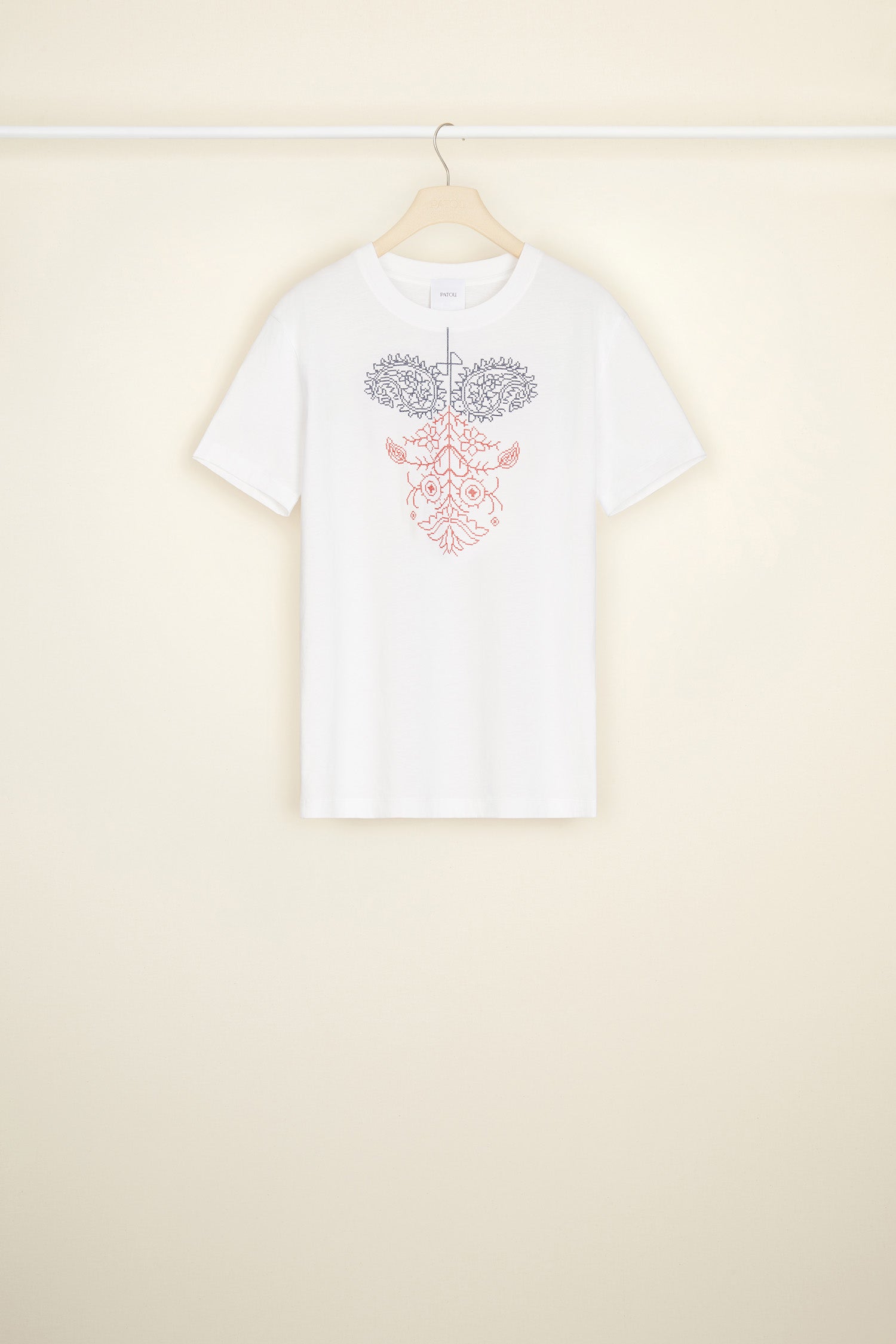 Patou - Embroidered T-shirt in organic cotton - White - An embroidery masterclass, a simple white tee with the mark of Patou high class. White organic cotton t-shirt. Crewneck style. Regular fit. Navy and red embroidery featuring a JP logo, paisley-style shapes, a heart and a floral-inspired pattern.