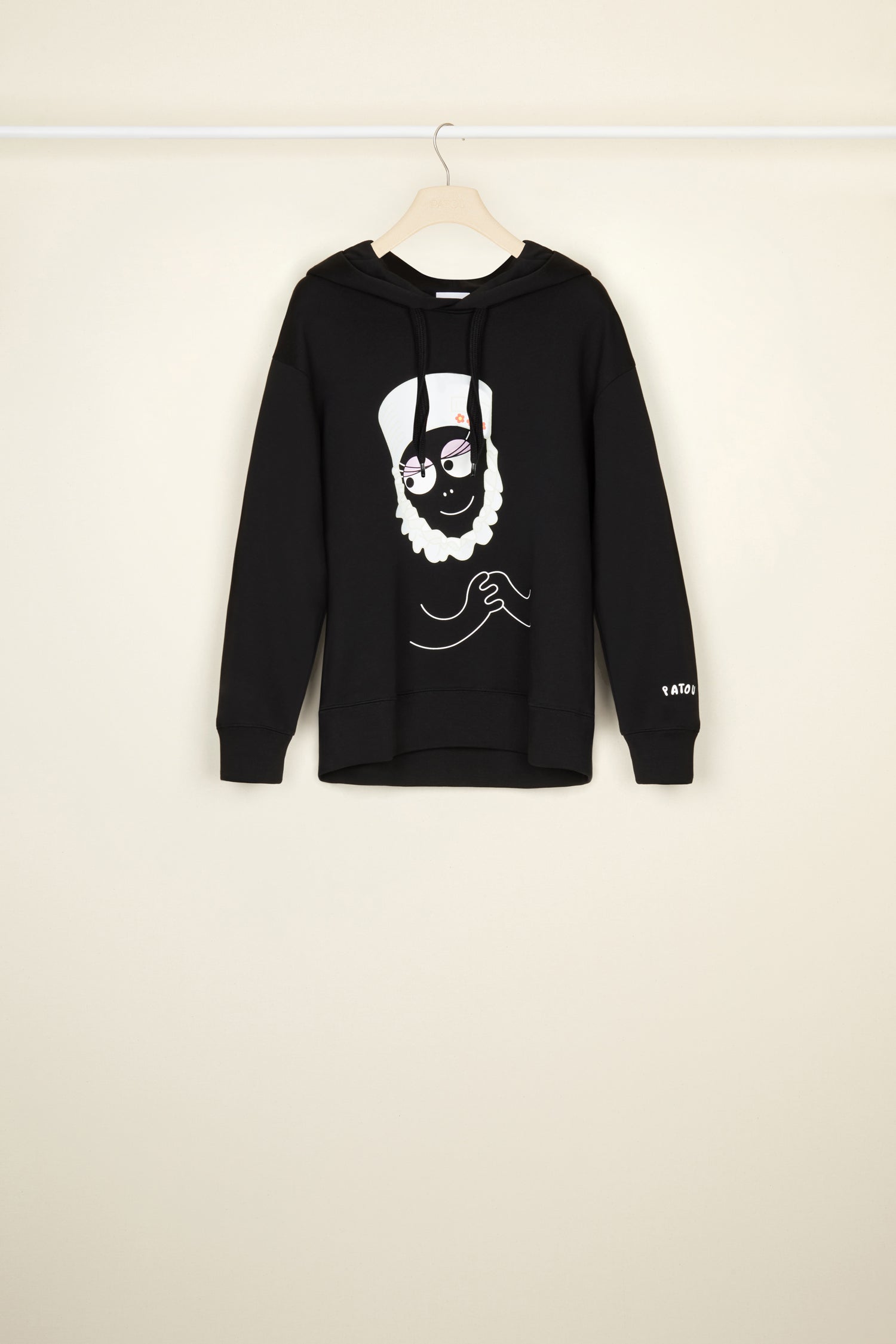 Patou - Barbamama unisex hoodie in organic cotton - Black - A Barbamama hoodie to make the everyday fun and merry.Black organic cotton hoodie. Part of the Barbapatou capsule collection from a special collaboration with Barbapapa. Hooded collar with drawstring fastening.  Barbamama in a  signature Patou hat printed across the front. Revisited Patou logo on the left sleeve. Ribbed cuffs and waist.Unisex look (select one size up for men).