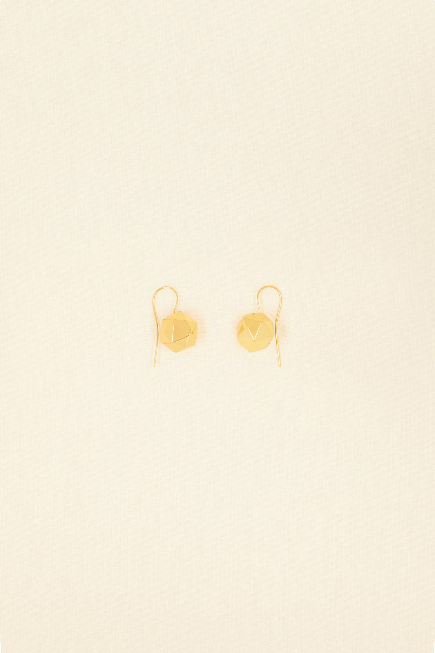 Patou - Faceted bead brass earrings - Gold - A multi-faceted bead to reflect all your moods. Gold-plated brass pendant earrings. Faceted bead attached to a hook.