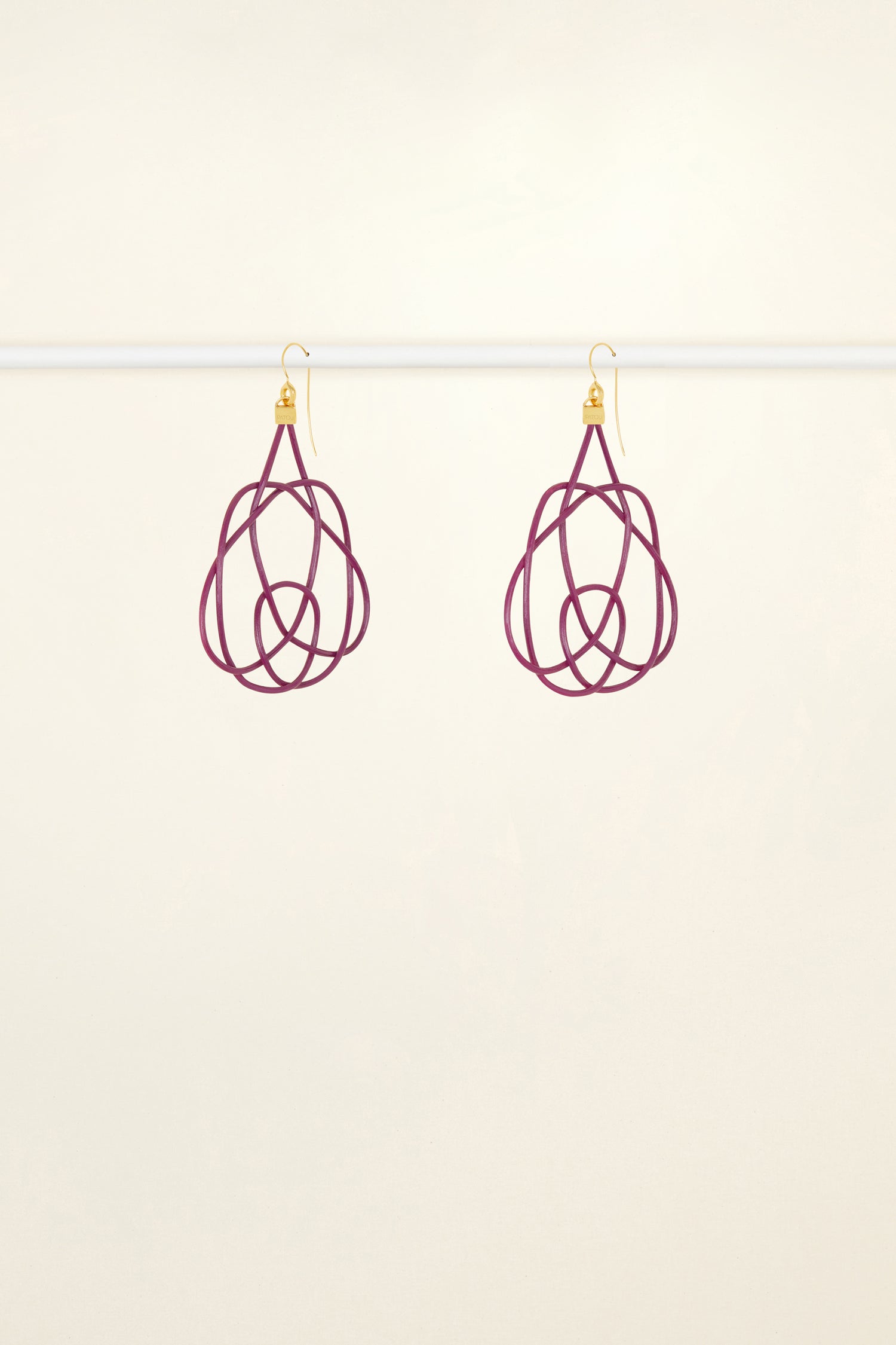 Patou - Wicker earrings - Anemone - Lighter, brighter, our favourite earrings are made of wicker.Anemone purple painted wicker earrings. Symmetric curved shape. Hook fastening suitable for pierced ears.