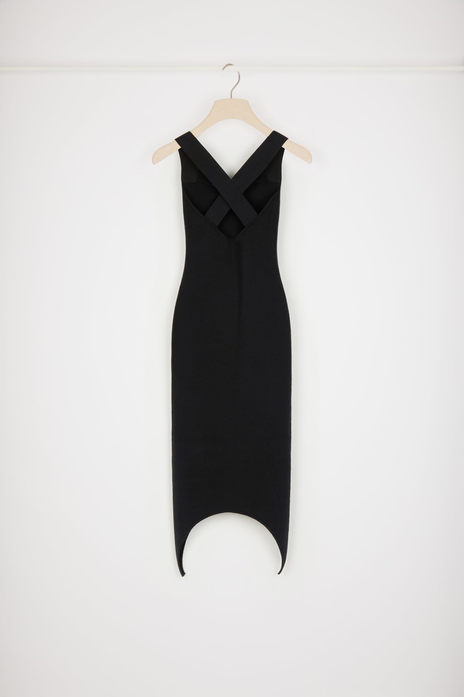 Patou - Curve hem knit dress in wool blend - Black - The new Patou hemline offers a masterclass in sophisticated seduction.Black wool blend dress. Fitted style. Wide straps that cross at the back. Sweetheart neckline. Zip fastening at the back. Curved hem.This dress is very skin-tight.