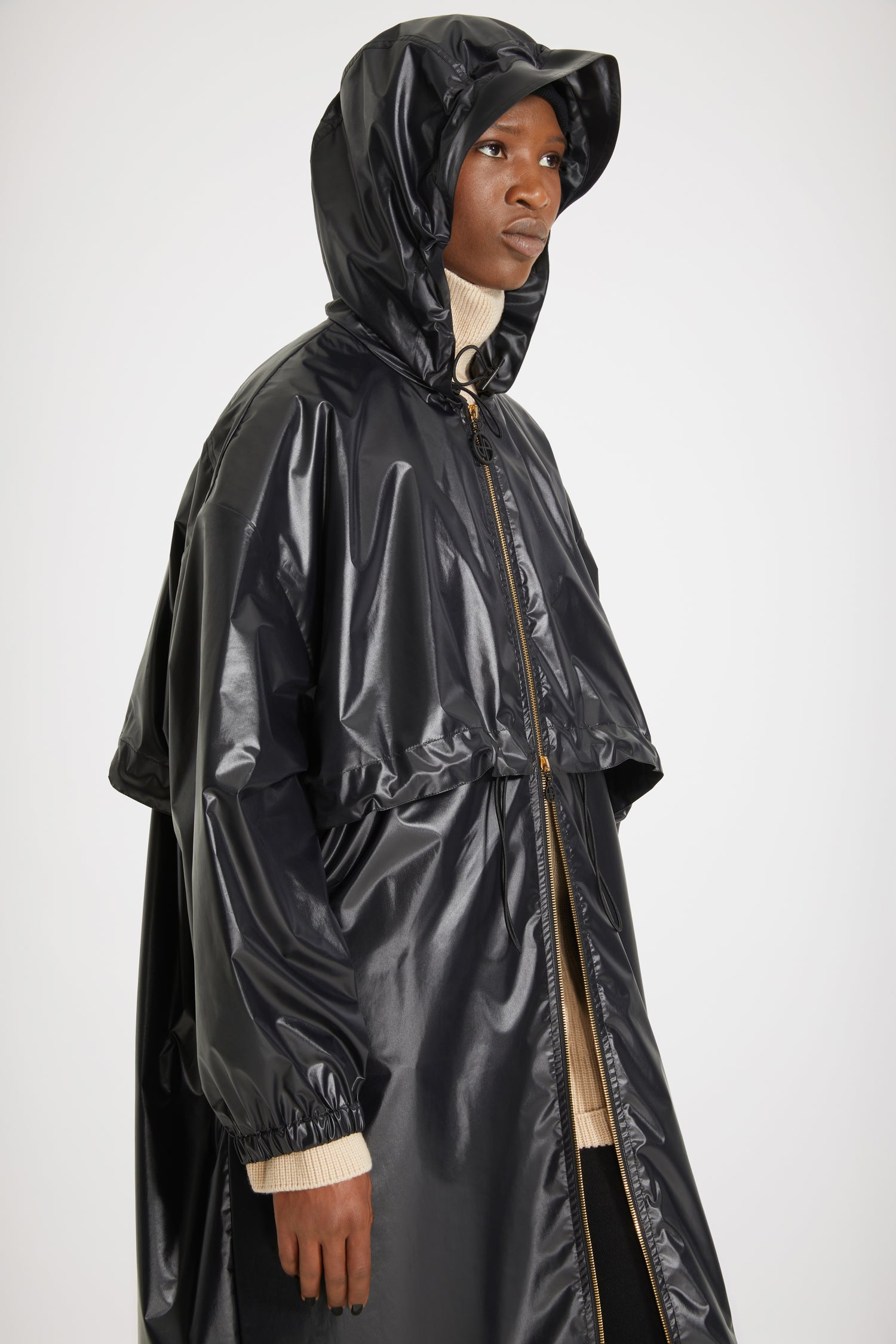 Patou - Signature raincoat in water-repellent polyester - Black - Singing in the rain, dreaming in Patou.Black polyester blend raincoat. Lightweight water-repellent design. Hooded collar with drawstring. Two-way gold-tone zip with black JP pullers inspired by a heritage keyring from the Jean Patou archive. Storm flap with adjustable drawstring. Elasticated cuffs. Loose fit (select one size down for a fitted look).