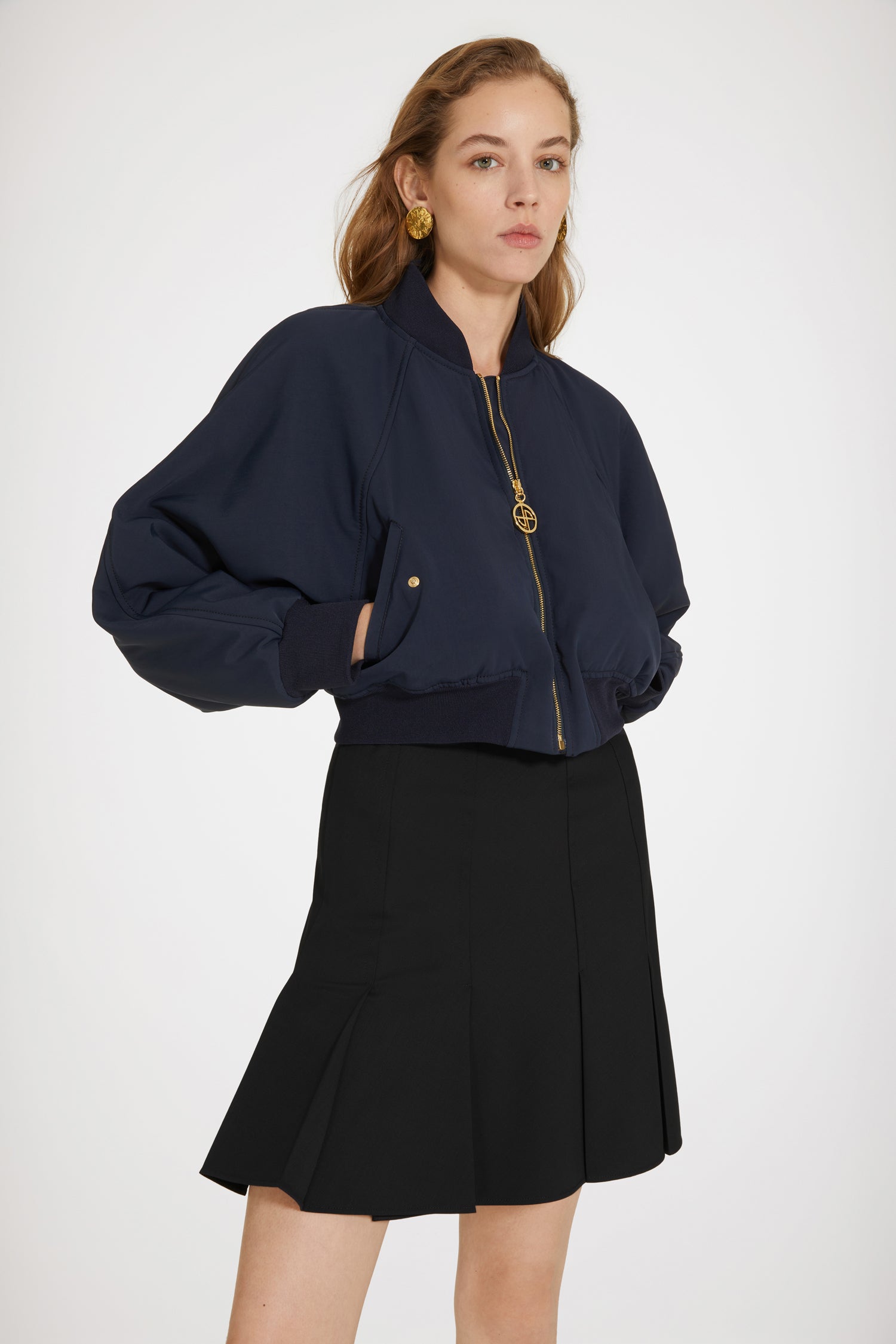 Patou - Cropped bomber jacket in recycled nylon - No Back Embroidery Navy - The bomber gets a Patou makeover. Night blue recycled tech nylon bomber. Cropped silhouette. Rib knit collar, cuffs and waist. Gold-tone zip fastening with signatue JP puller. Raglan sleeves. Diagonal pockets with gold-tone press buttons at the front.
