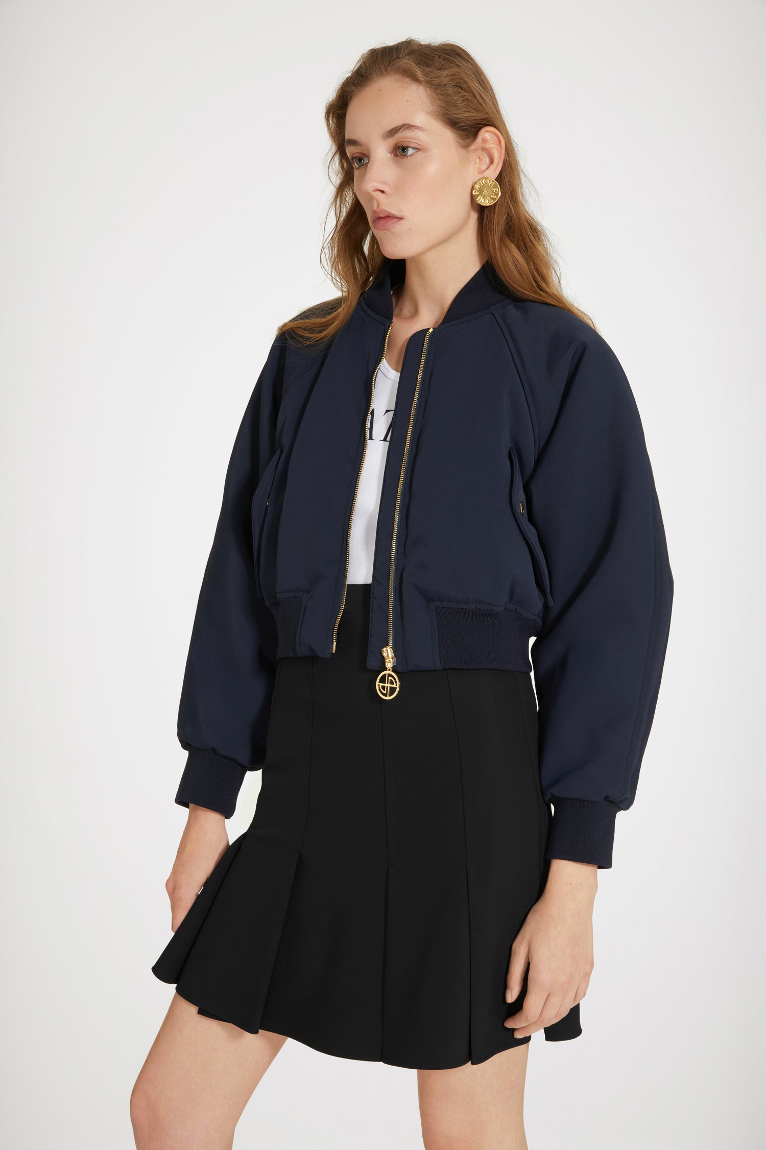 Patou - Cropped bomber jacket in recycled nylon - No Back Embroidery Navy - The bomber gets a Patou makeover. Night blue recycled tech nylon bomber. Cropped silhouette. Rib knit collar, cuffs and waist. Gold-tone zip fastening with signatue JP puller. Raglan sleeves. Diagonal pockets with gold-tone press buttons at the front.