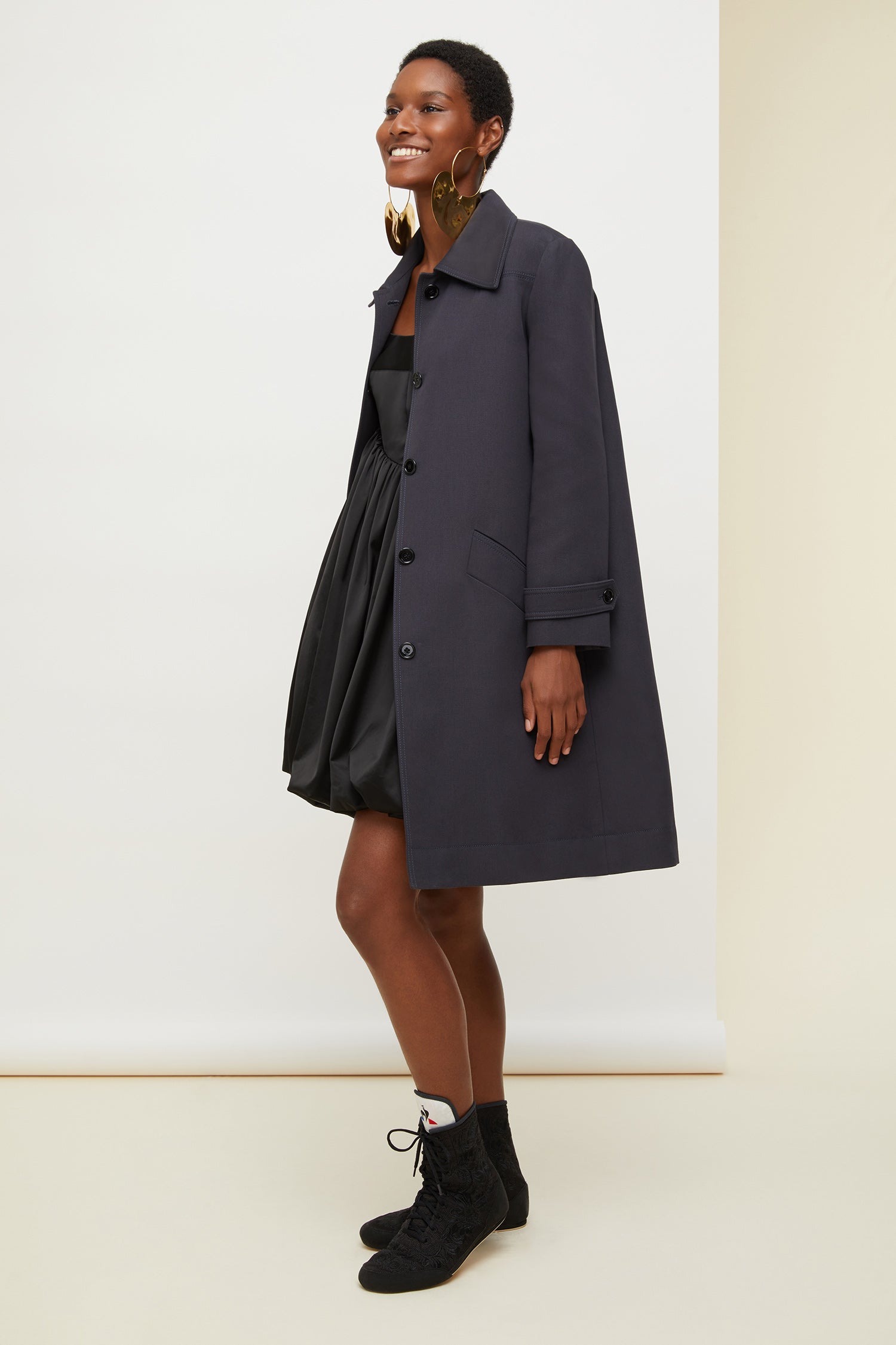 Patou - Ruffle hem gabardine coat - Storm - No frills? No thank you!Storm cotton gabardine overcoat. Straight silhouette, raglan sleeves. Button fastening. Two side pockets. Buttoned tabs on the cuffs. Detachable ruffle hem.