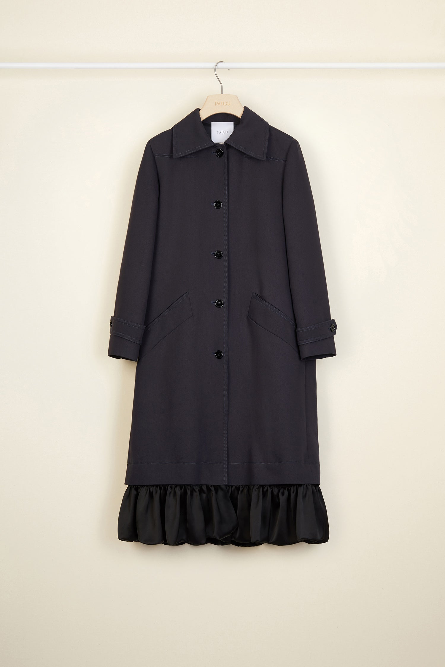 Patou - Ruffle hem gabardine coat - Storm - No frills? No thank you!Storm cotton gabardine overcoat. Straight silhouette, raglan sleeves. Button fastening. Two side pockets. Buttoned tabs on the cuffs. Detachable ruffle hem.