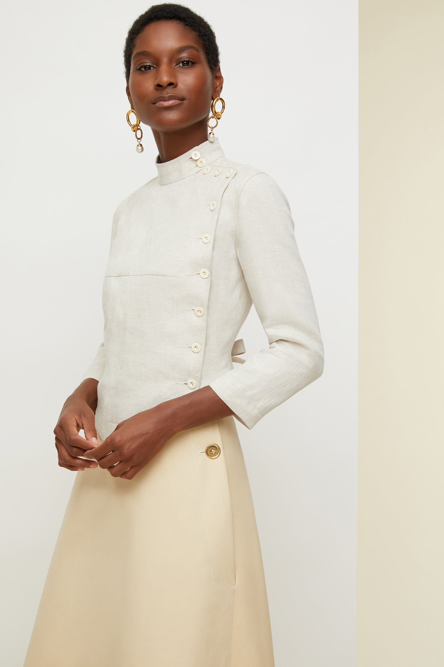 Patou - Linen and silk fencing jacket - Cream - The art of finding style in unexpected places.Cropped cream linen and silk jacket inspired by fencing uniforms. High collar and buttons at the side. Self-tie martingale at the back.