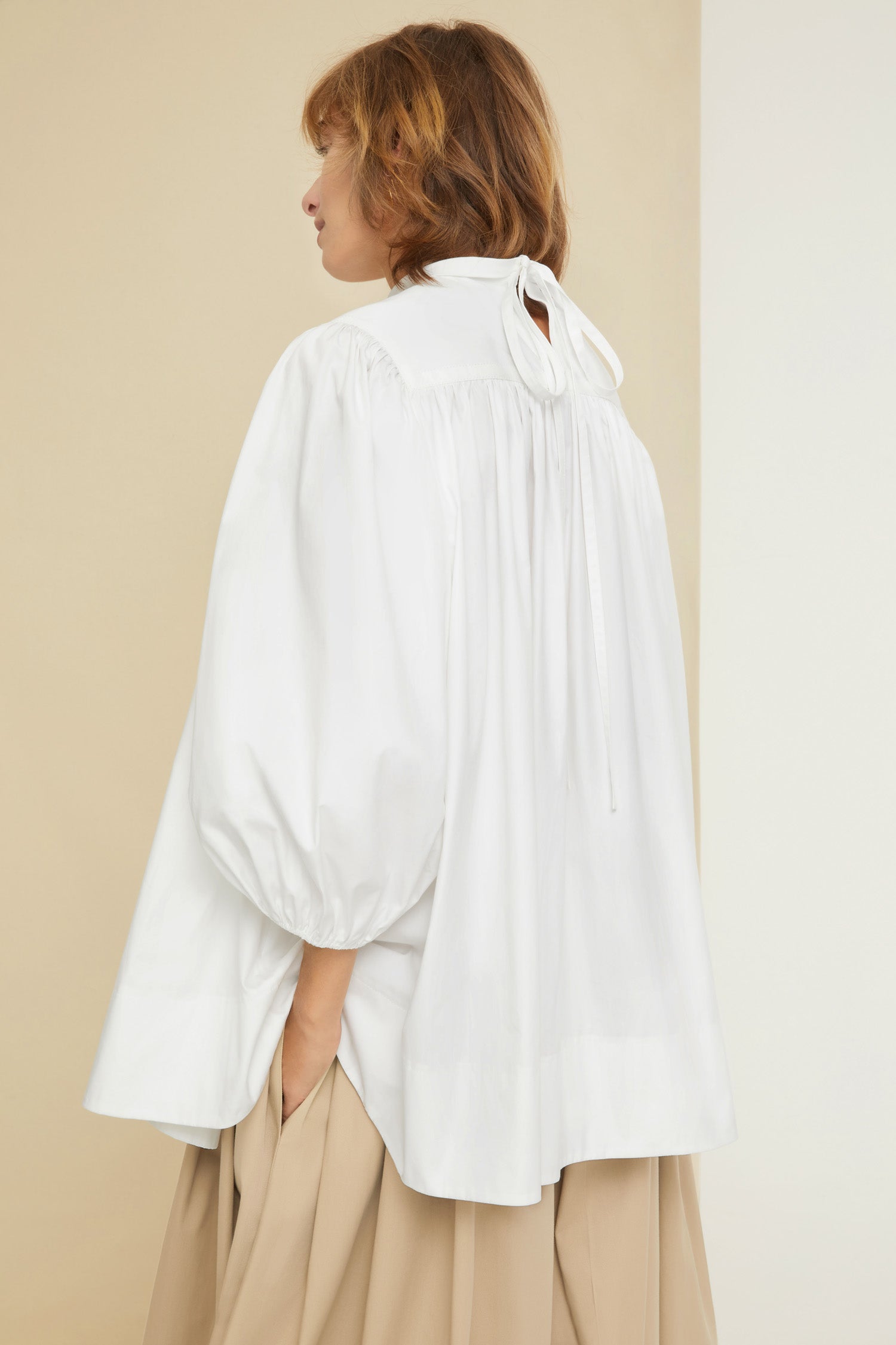 Patou - Communion cotton top - White - Fine details that speak volumes.White organic cotton poplin top. Oversized silhouette. Round collar with yoke and tie fastening at the back. Puff sleeves with elasticated cuffs.