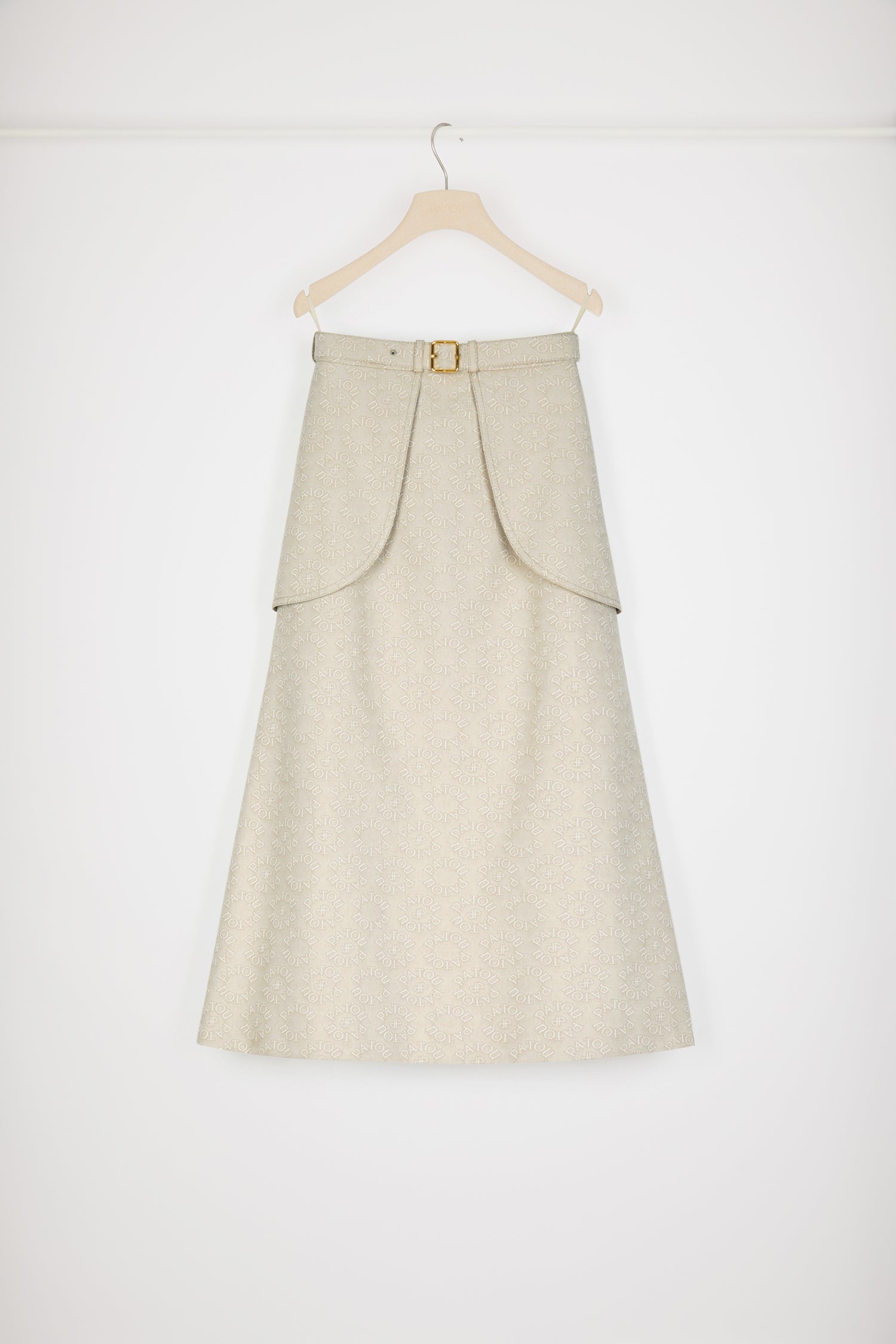 Patou - Pocket midi skirt in organic cotton jacquard - Medallion - Statement pockets make for a sensational skirt.Organic cotton jacquard skirt. Seasonal Medallion pattern featuring the Patou lettering logo and JP monogram all over. Midi length. A-line construction. Adjustable belt at the waist with gold-tone buckle and belt loops. Maxi pockets at the front. V seam and darts at the back. Tonal topstitching.