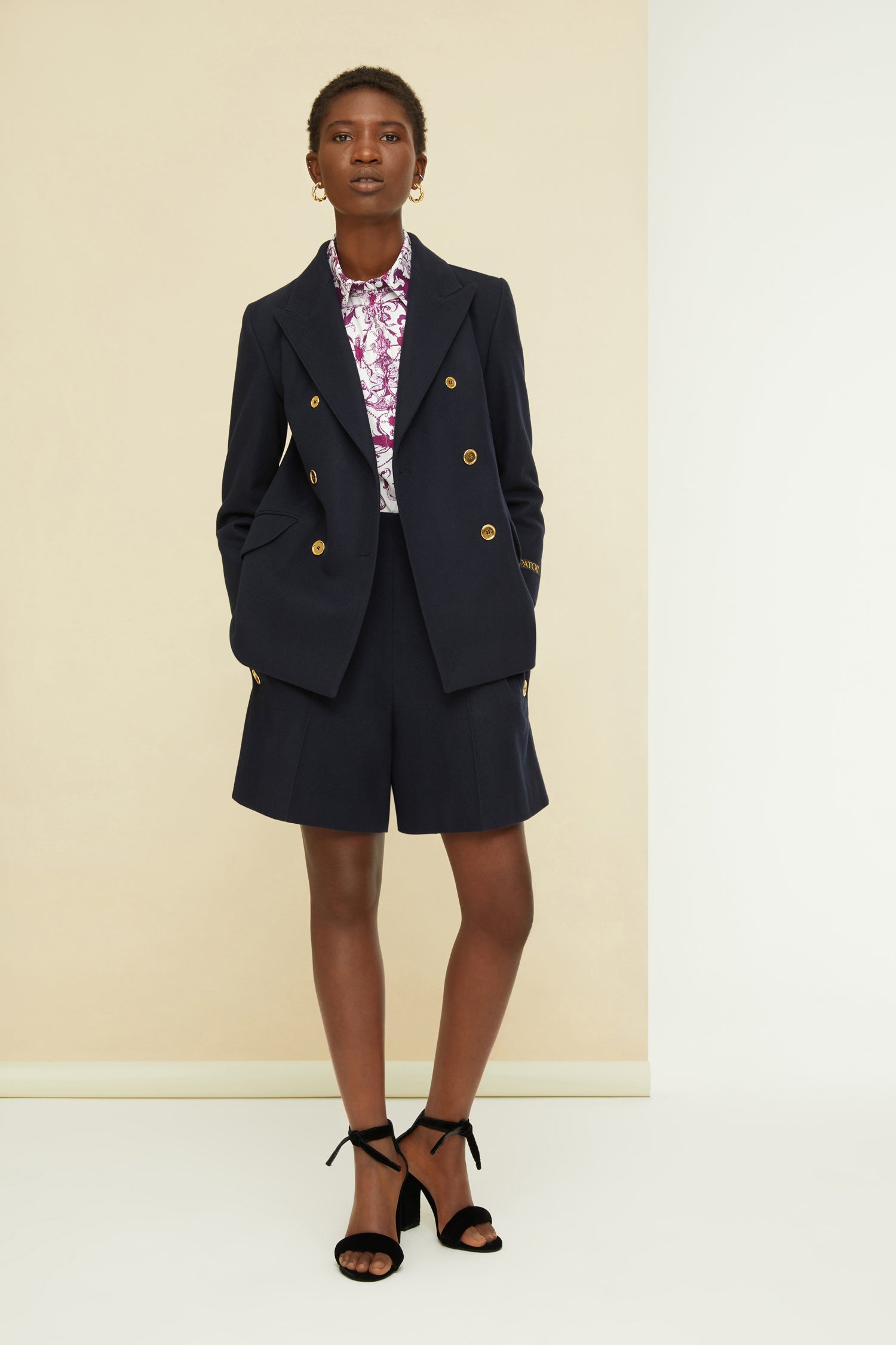 Patou - Iconic cashmere and wool shorts - Navy - High-shine buttons brighten up dark wool.Patou’s iconic tailored shorts in navy cashmere and wool flannel. High-waisted style with two rows of engraved gold-coloured buttons at the sides. Large side pockets. Concealed zip fastening at the back. Lined.